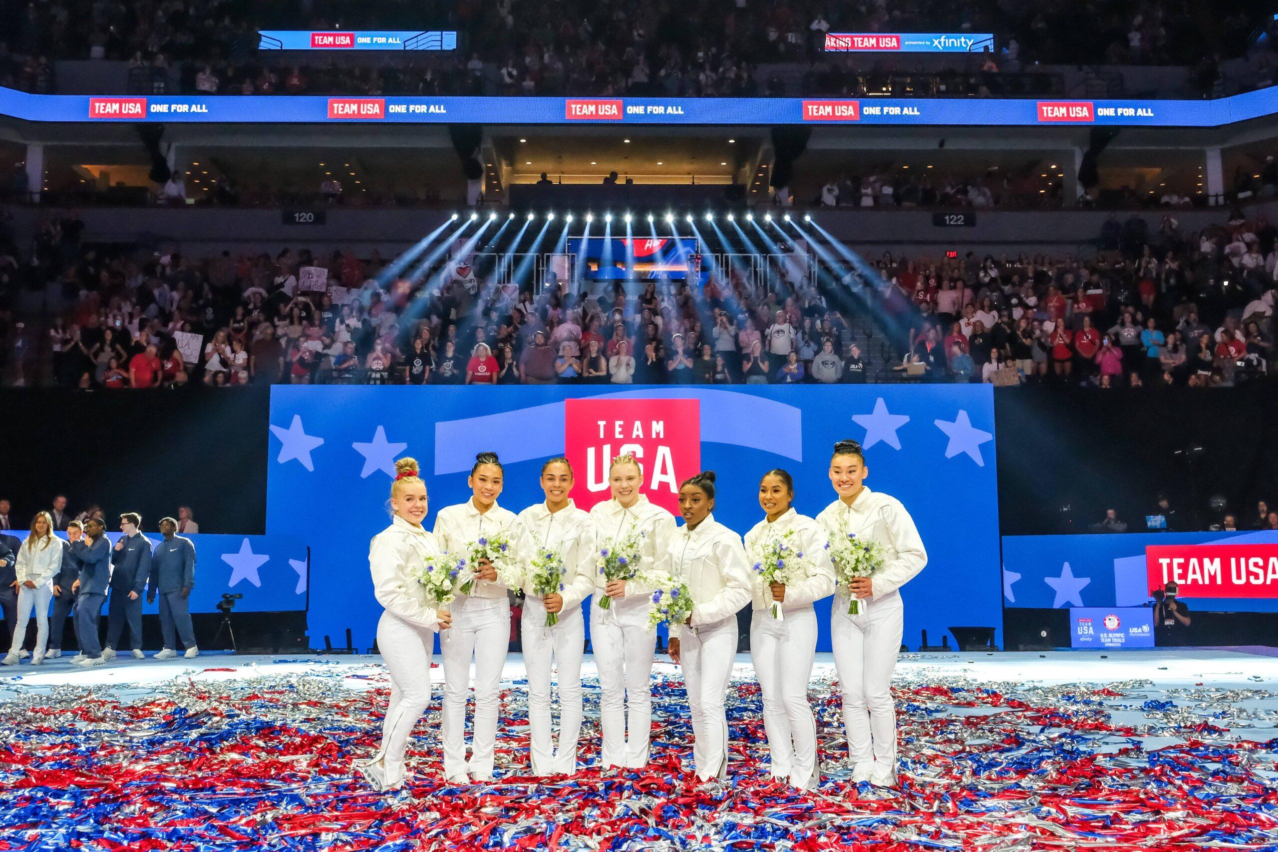 Simone Biles, Suni Lee, Jordan Chiles, Jade Carey, and Hezly Rivera posing as Team USA for 2024 Paris Olympics