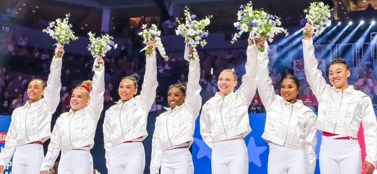 Simone Biles, Suni Lee, Jordan Chiles, Jade Carey, and Hezly Rivera posing as Team USA for 2024 Paris Olympics
