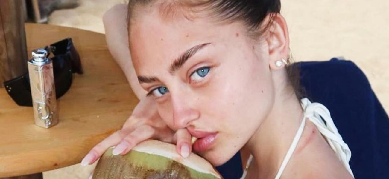 Leni Klum poses with a fresh coconut