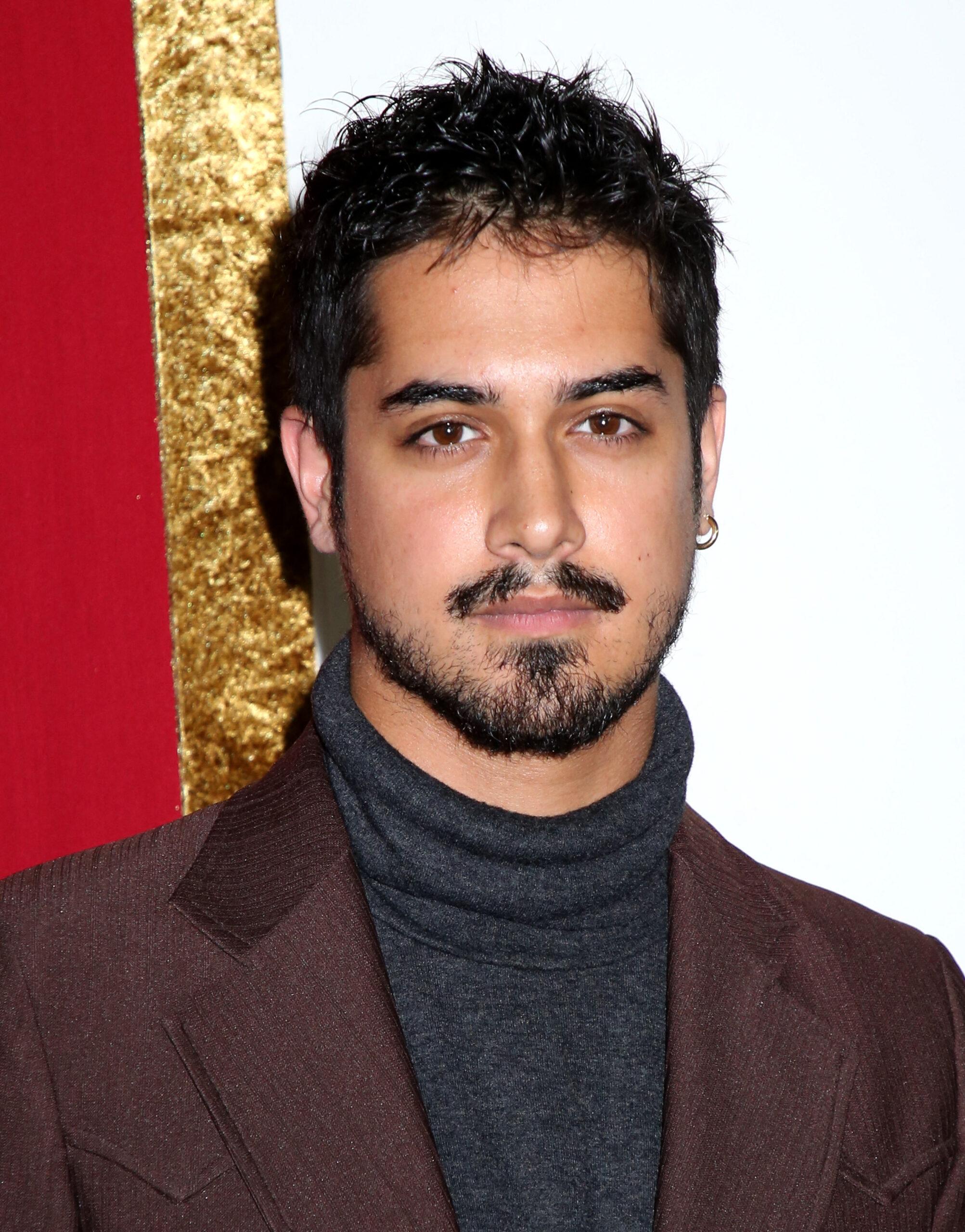 Avan Jogia poses on the red carpet at 'Shaft' Premiere