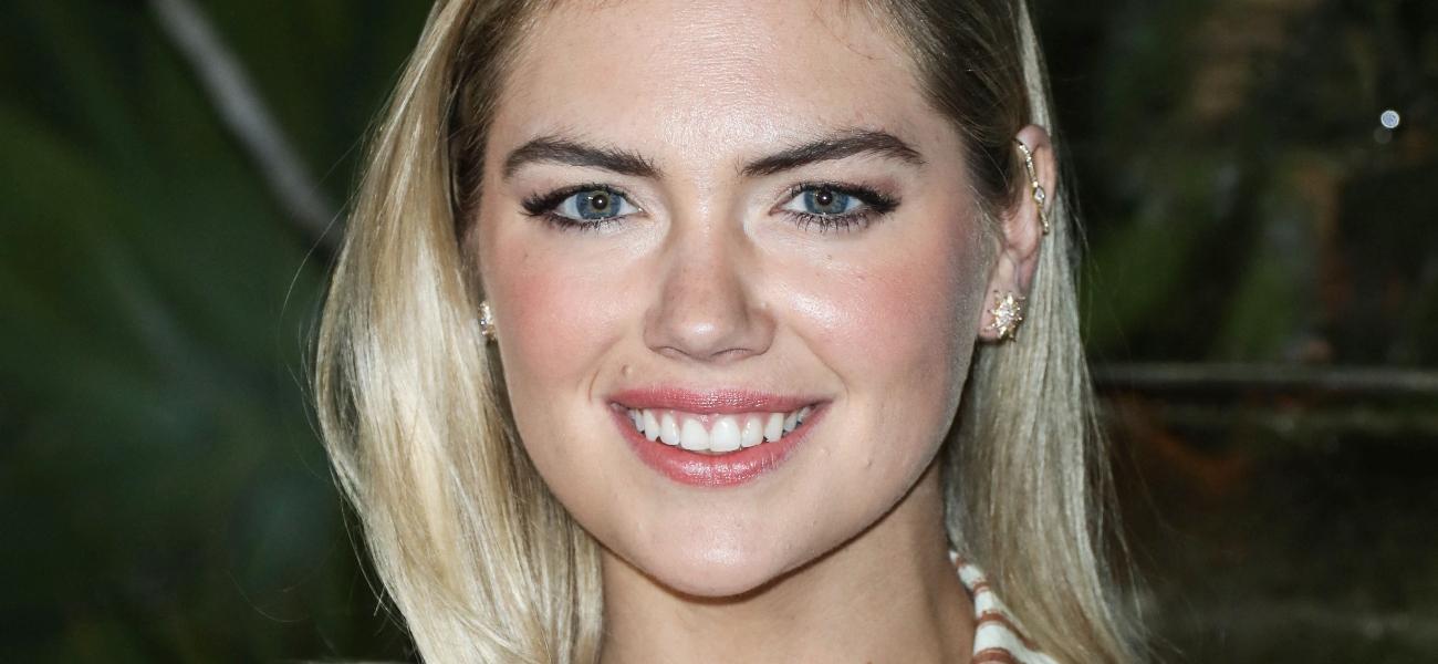 Kate Upton smiles at an event