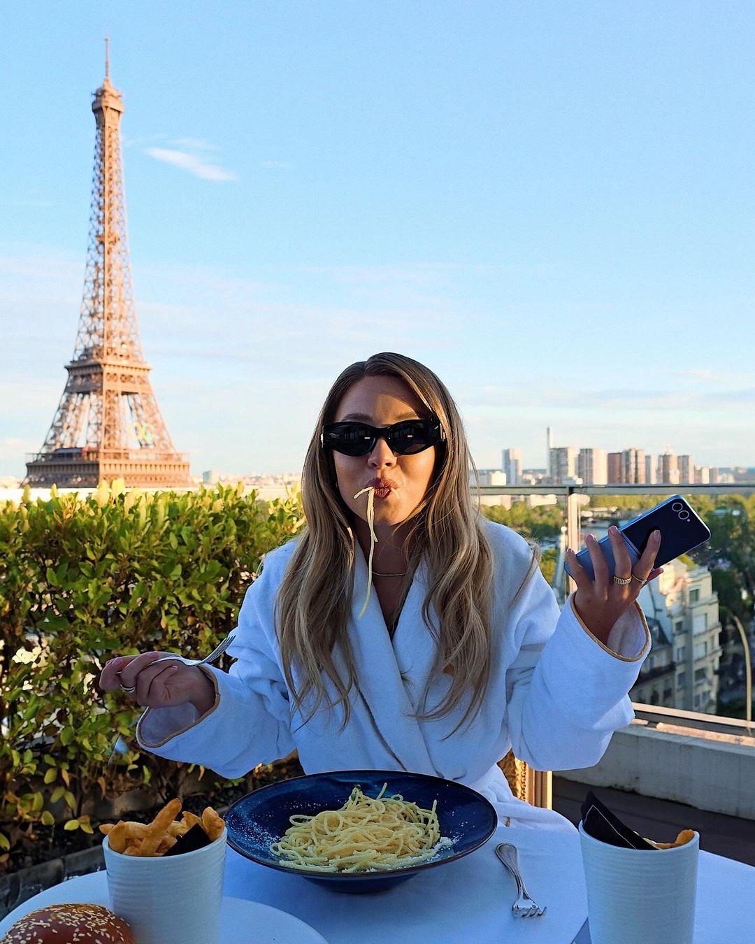 Sydney Sweeney eats a plate of spaghetti in Paris