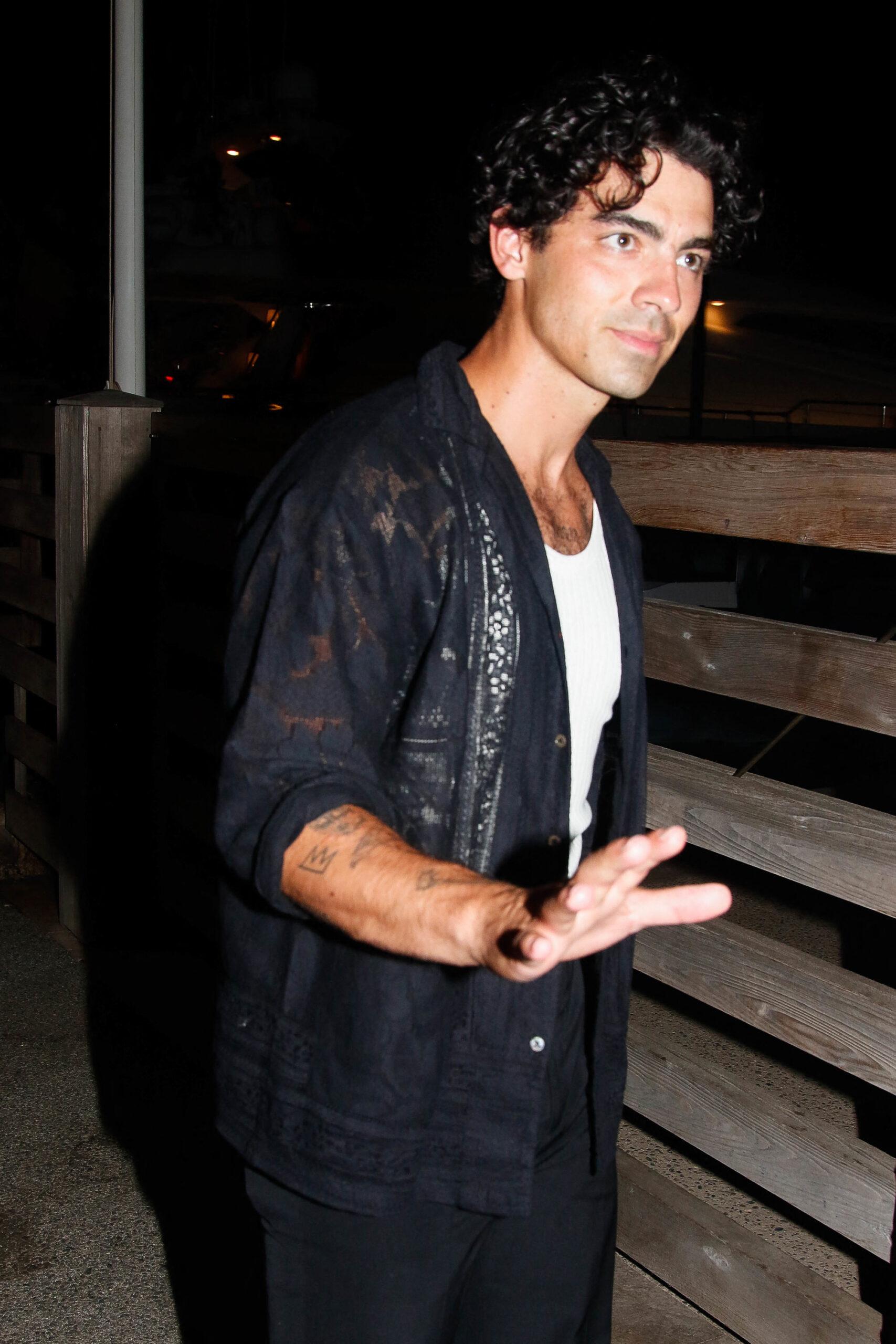 Joe Jonas leaving the harbor of Saint Tropez with a mysterious woman