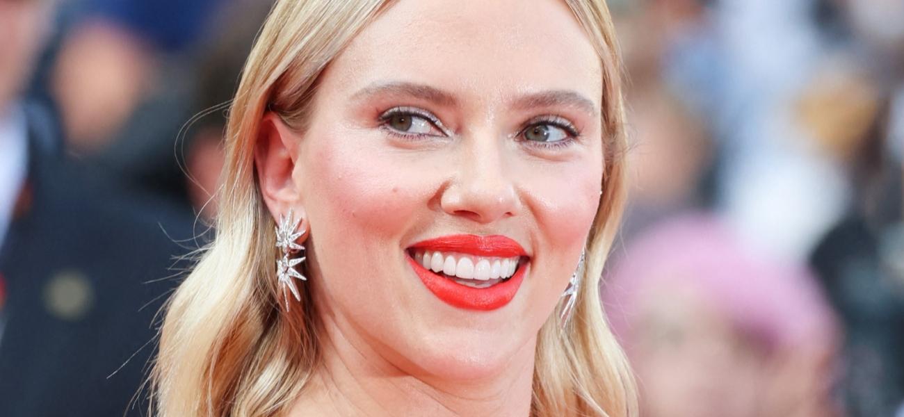 Scarlett Johansson smiles at an event