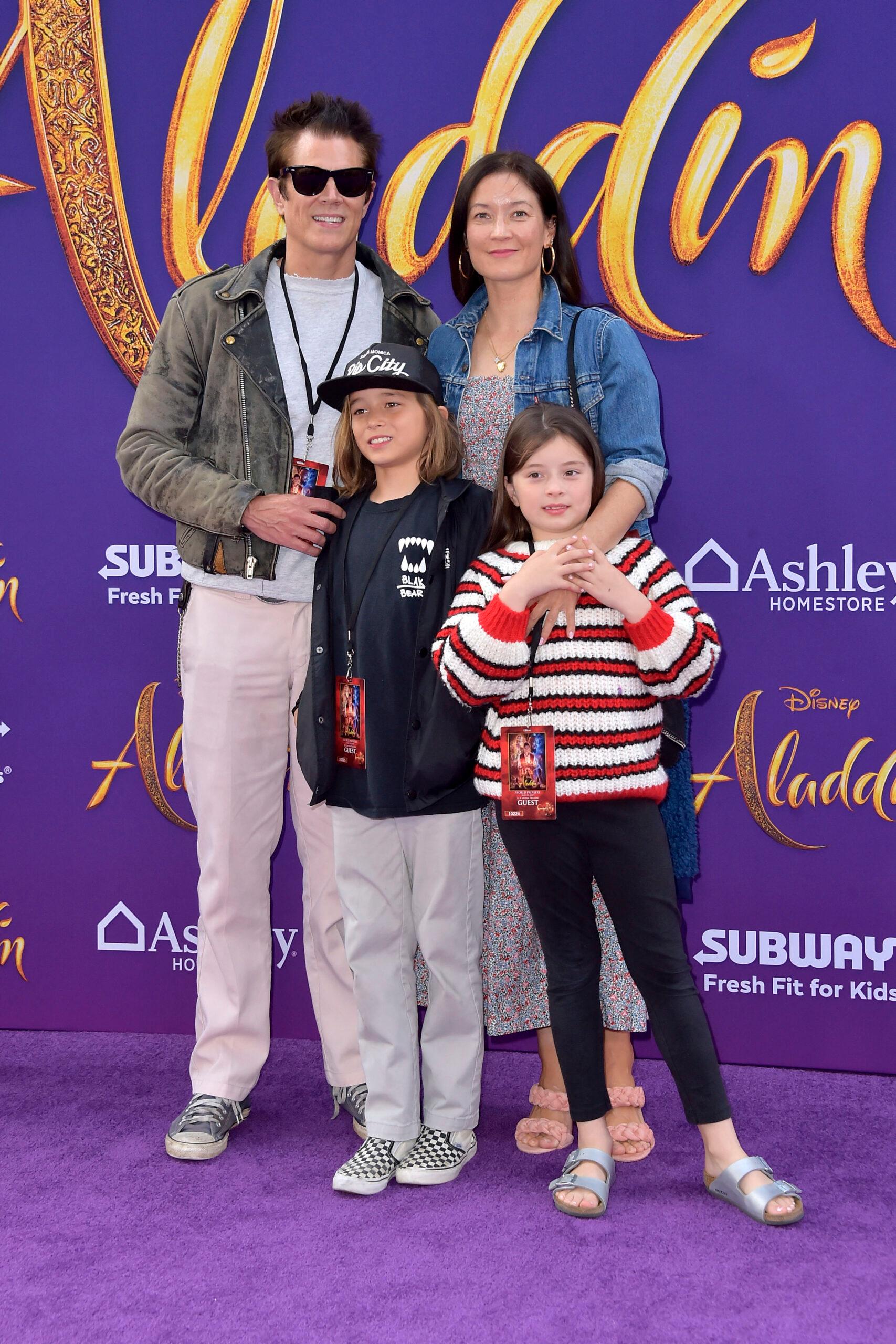 Johnny Knoxville and Naomi Nelson with their kids attend 'Aladdin' Premiere In Los Angeles