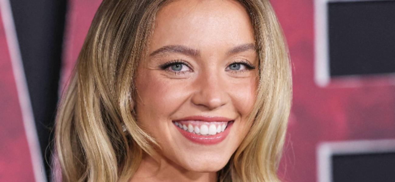 Sydney Sweeney smiling close up