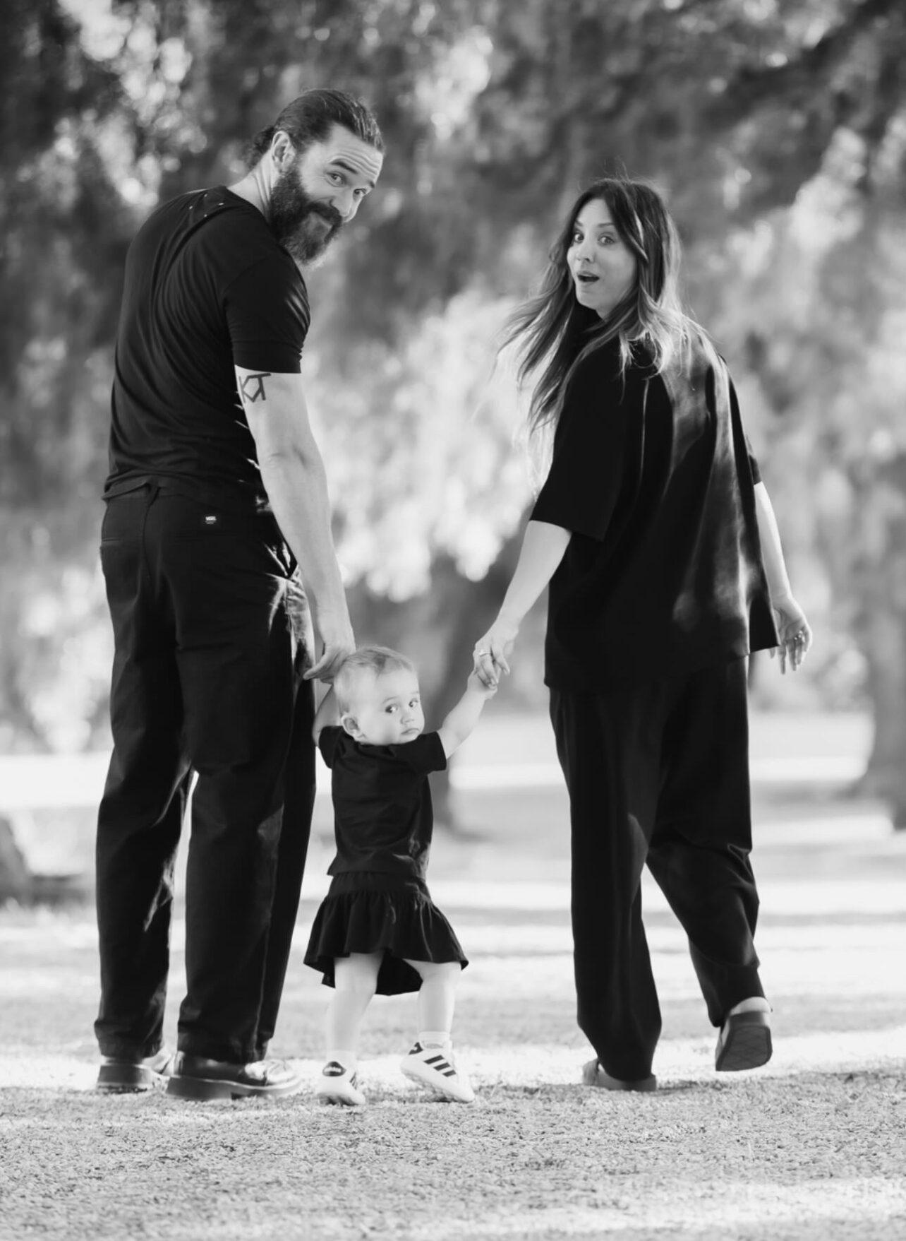 A portrait of Kaley Cuoco and Tom Pelphrey with their daughter.