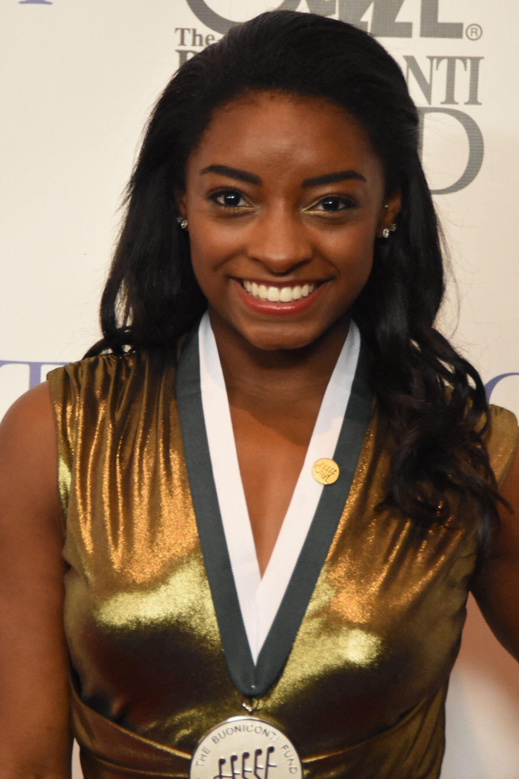 SIMONE BILES at the Great Sports Legends Dinner at the Hilton Hotel. 25 Sep 2017 Pictured: SIMONE BILES at the Great Sports Legends Dinner at the Hilton Hotel. Photo credit: ZUMAPRESS.com / MEGA TheMegaAgency.com +1 888 505 6342 (Mega Agency TagID: MEGA90104_008.jpg) [Photo via Mega Agency]