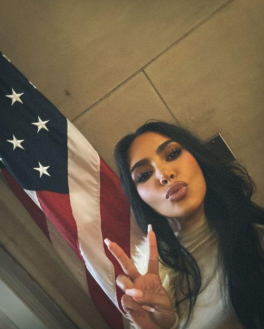 Kim Kardashian takes a selfie with American Flag