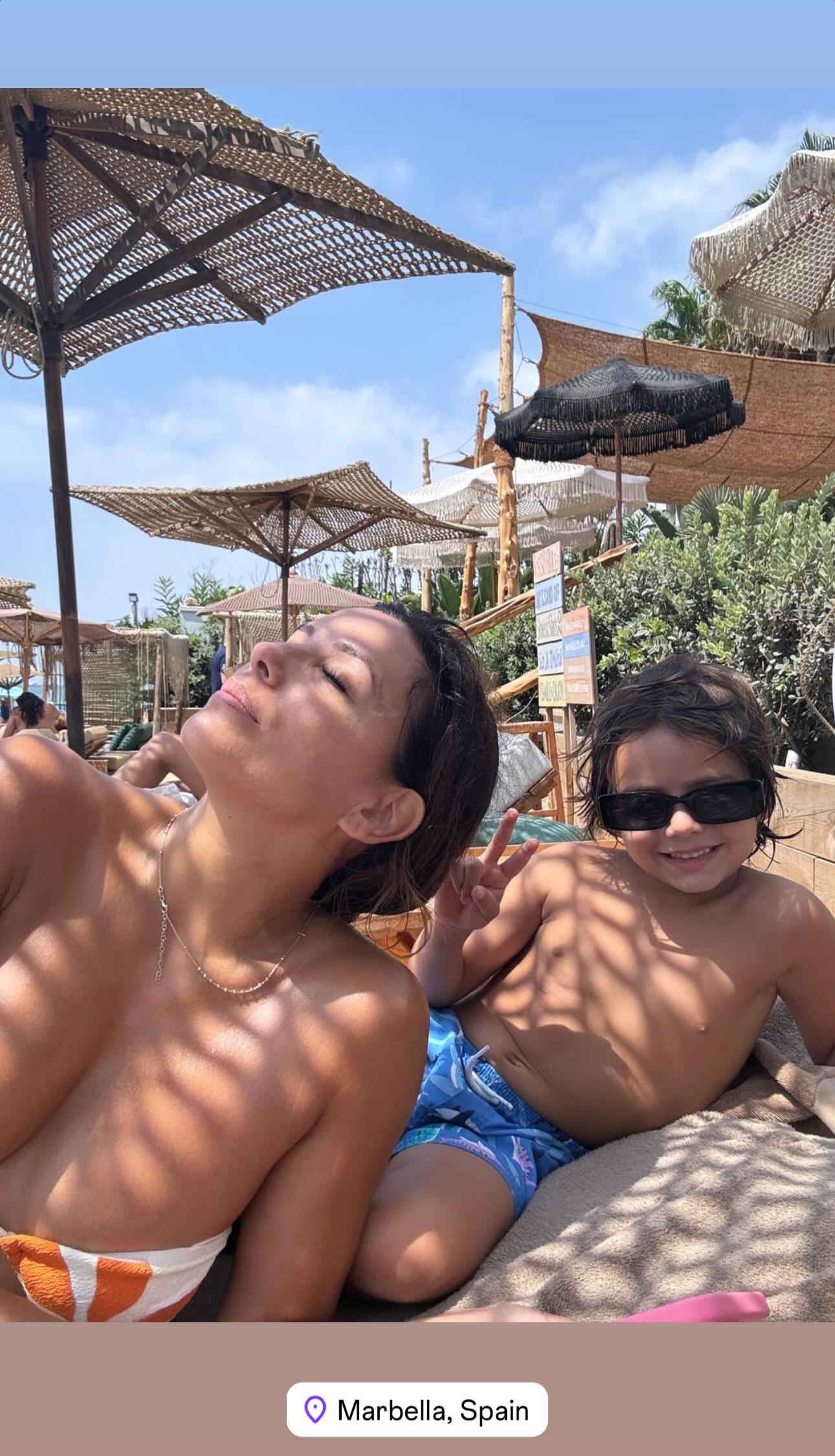 Eva Longoria spends time at the beach with son Santiago.