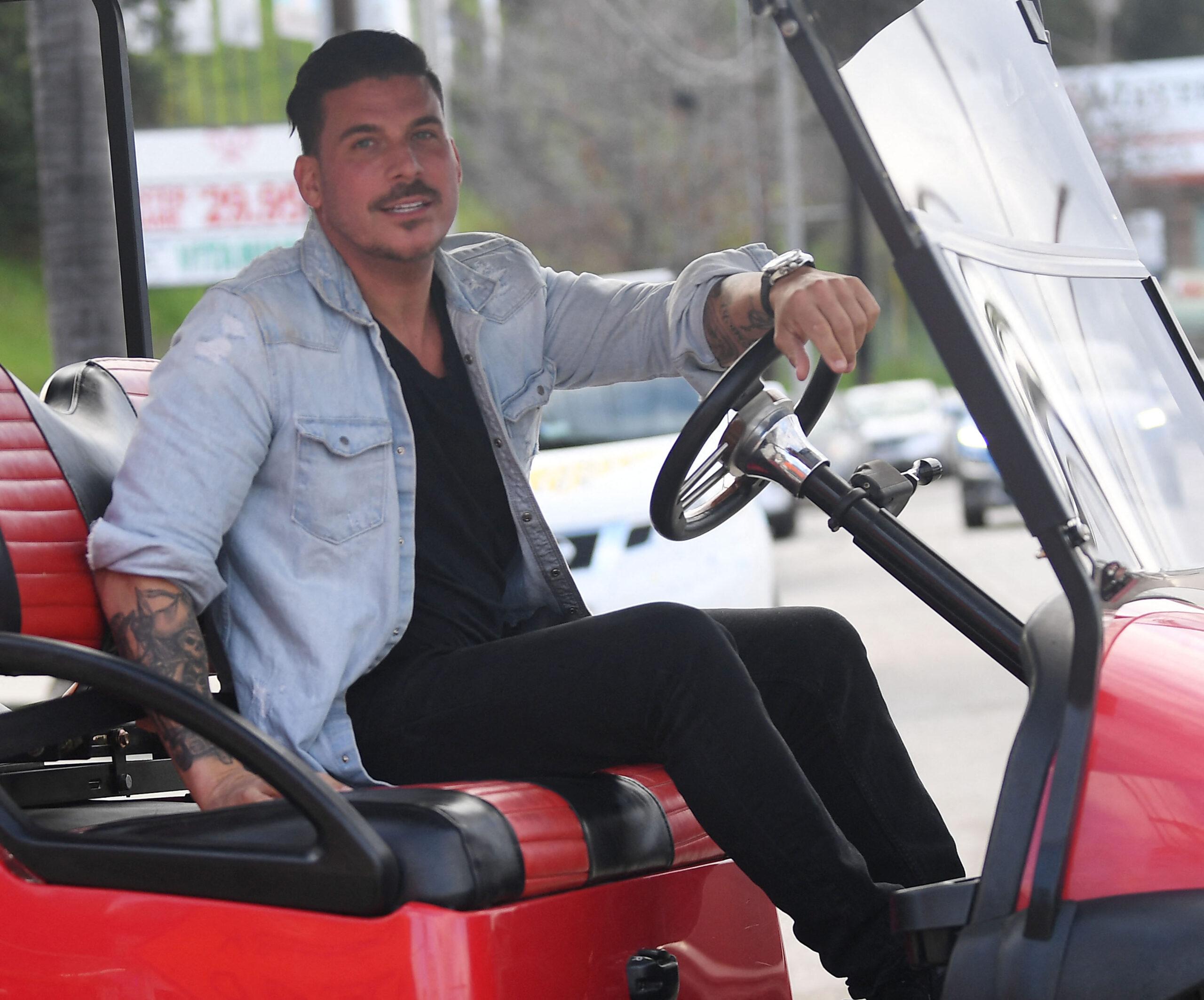 Jax Taylor smiles after his split from wife Brittany Cartwright as he leaves the courtship room on his ATV