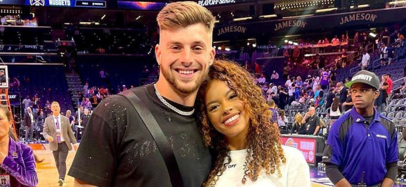 Ricky Pearsall and a woman at a basketball game