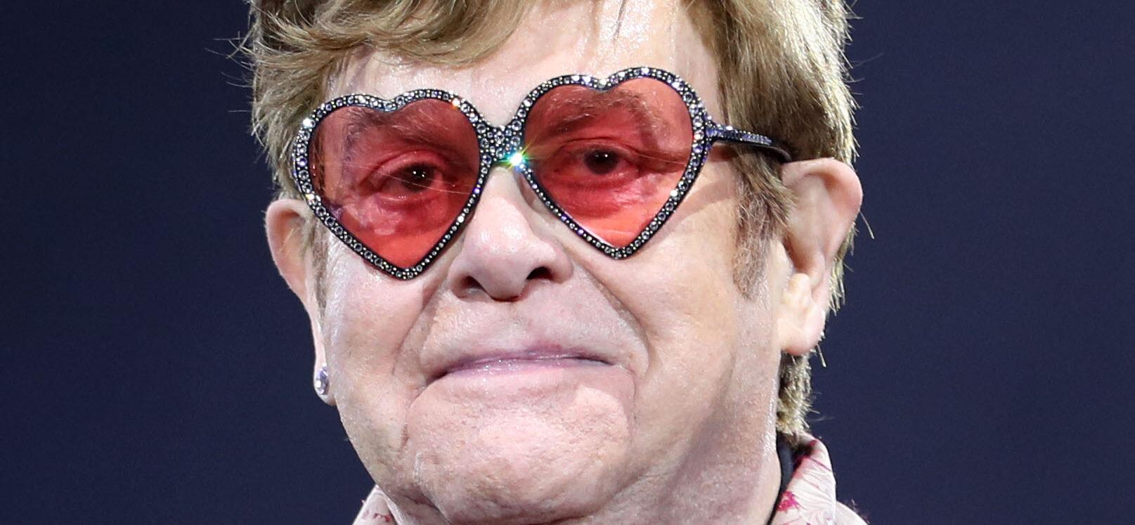 Elton John wearing heart-shaped glasses