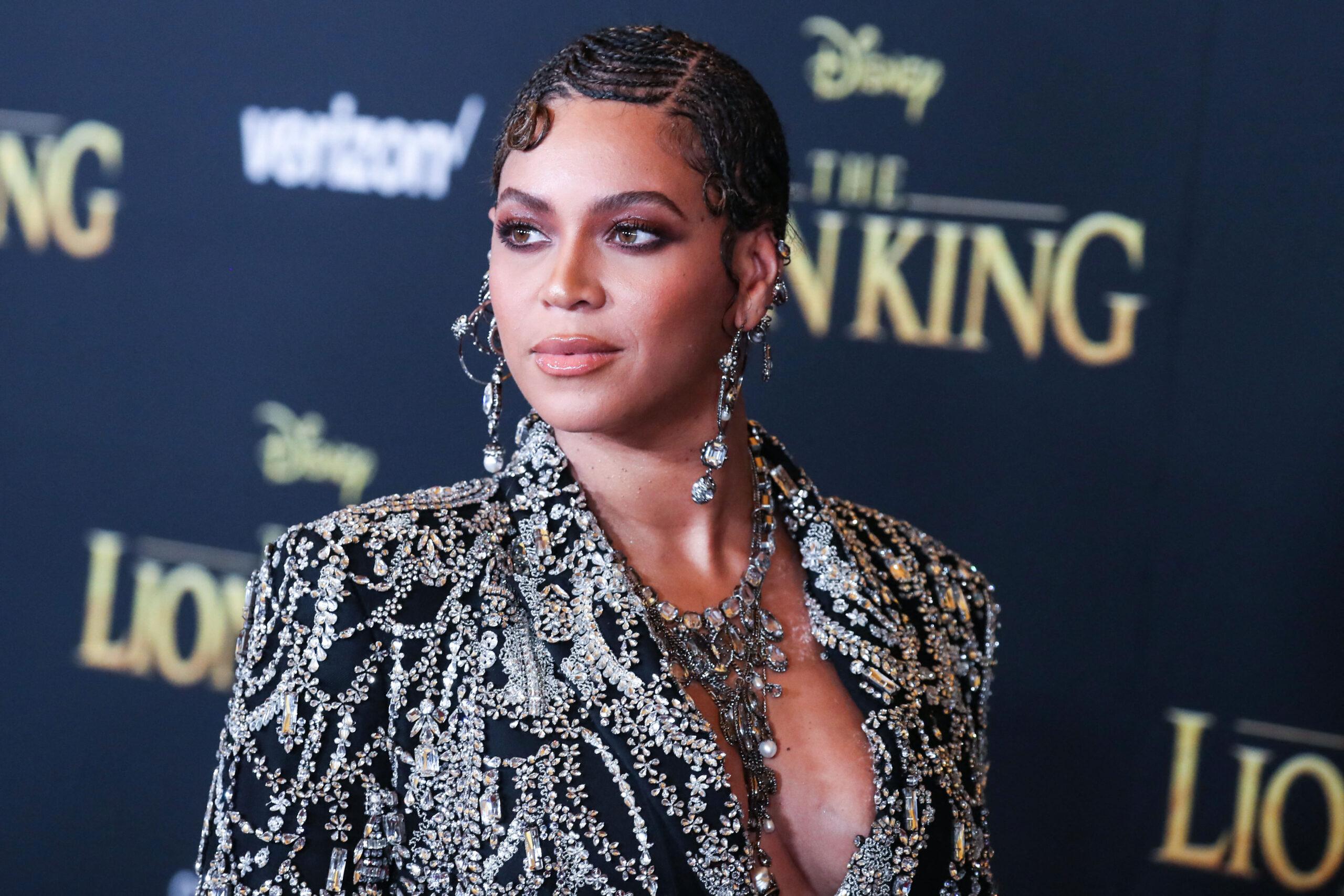 Beyonce Knowles Carter wearing an outfit by Alexander McQueen and Lorraine Schwartz jewelry arrives at the World Premiere Of Disney's 'The Lion King'