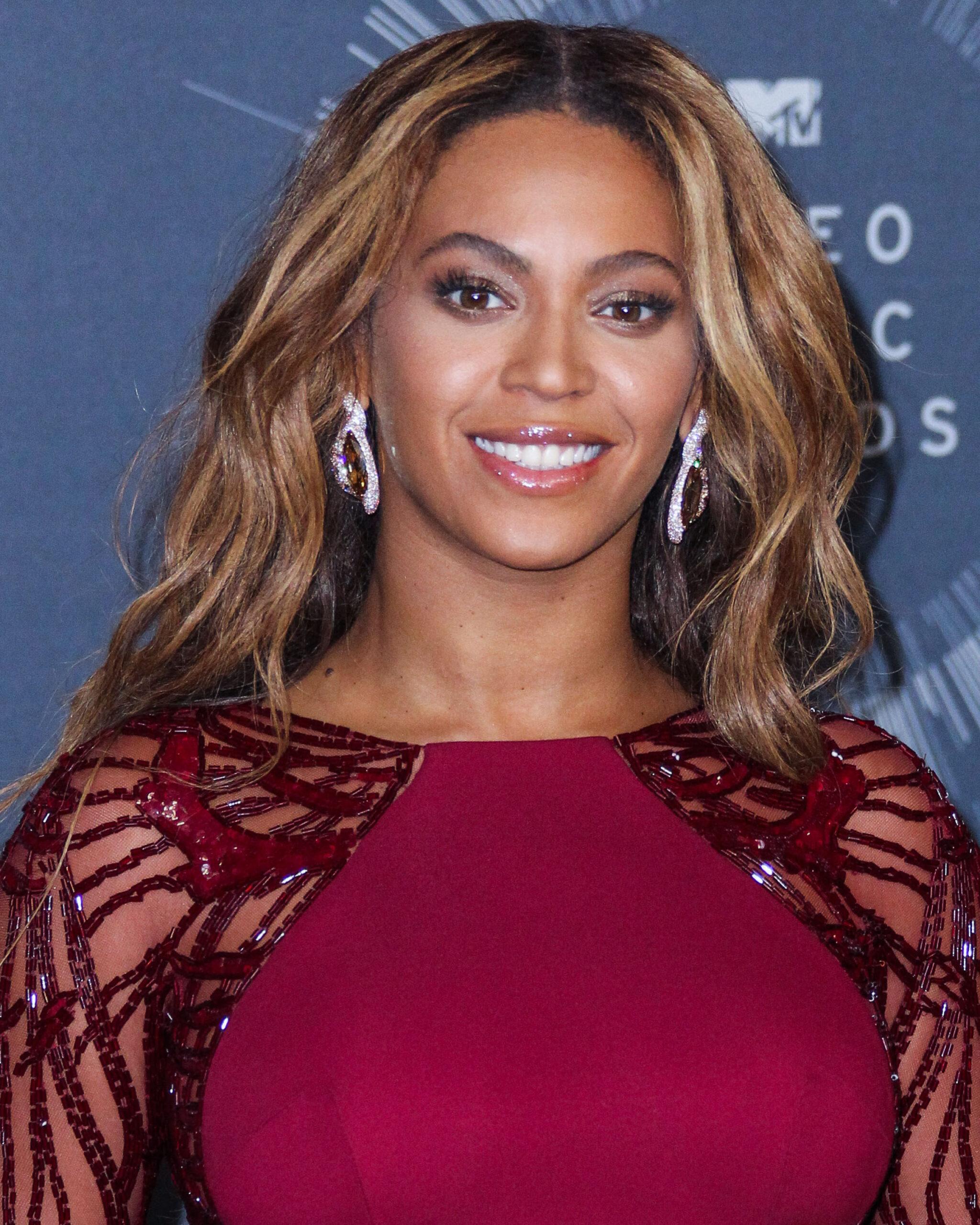 Beyonce in a maroon dress