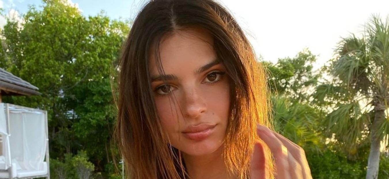 Emily Ratajkowski poses for the camera.