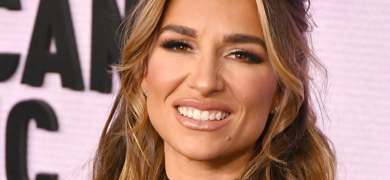 Jessie James Decker smiles at an event