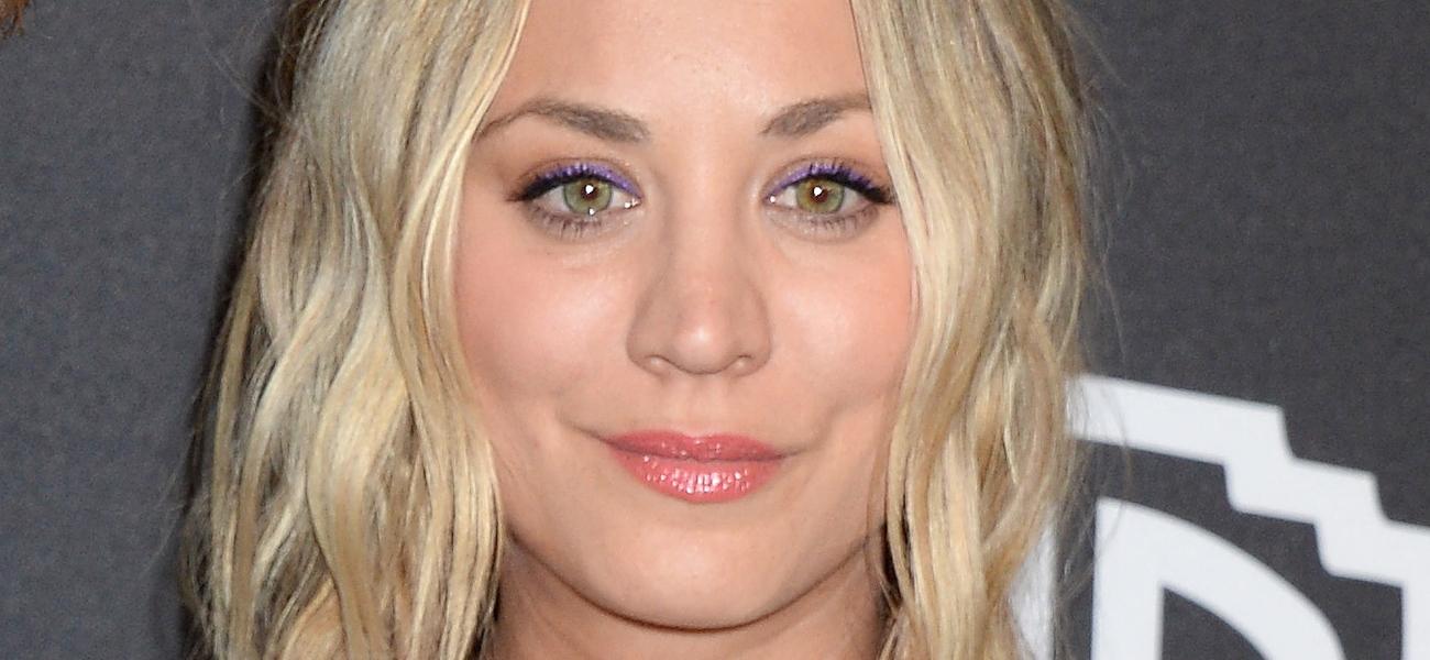 Kaley Cuoco smiles at an event