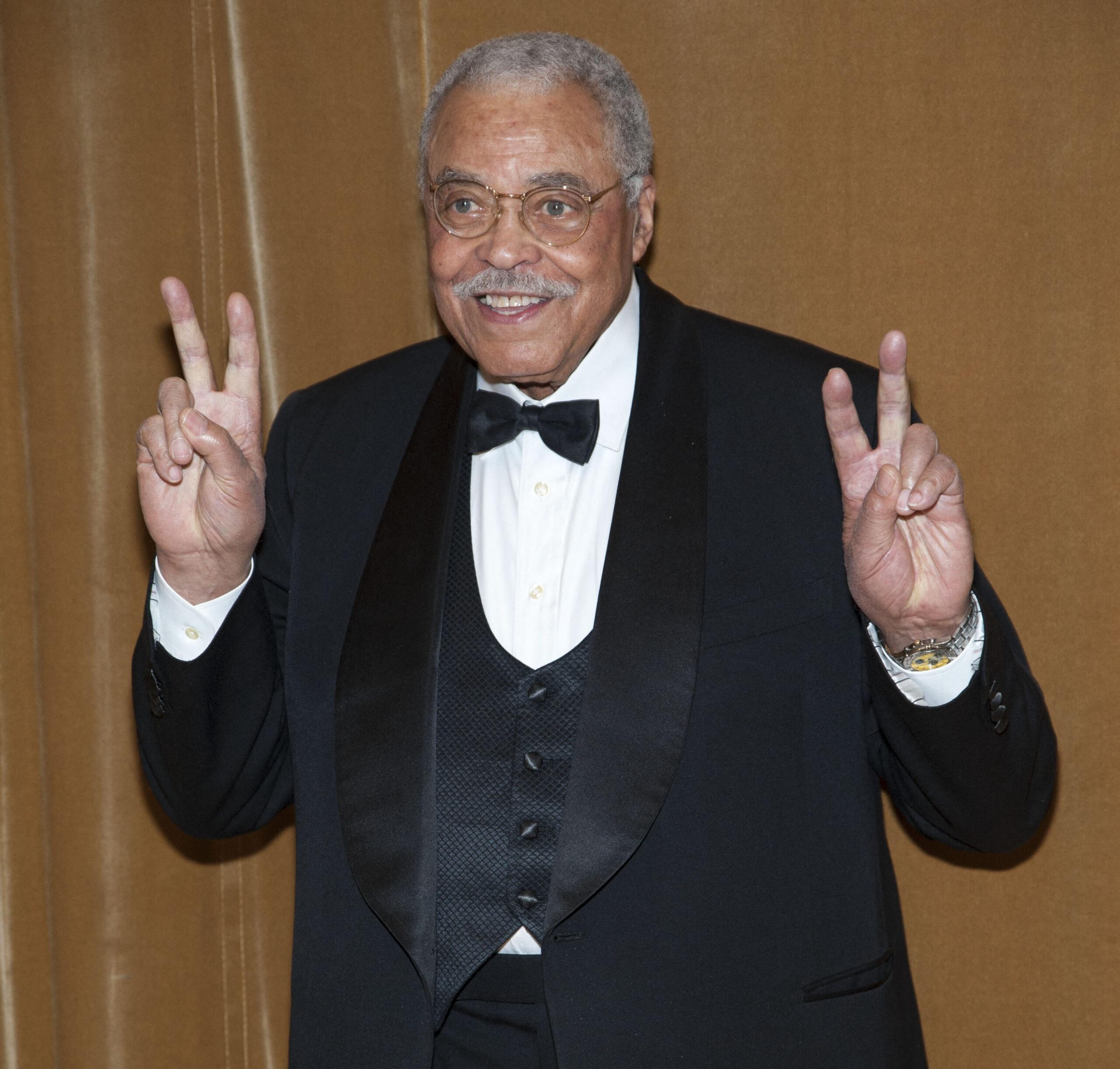 James Earl Jones holding up peace signs