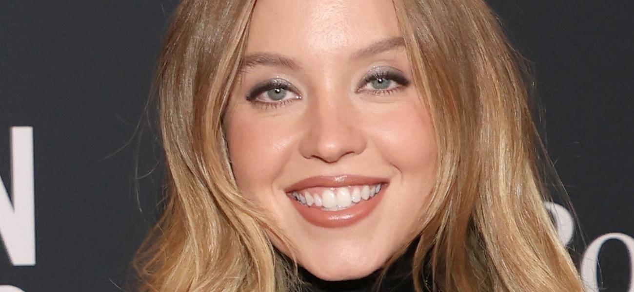 Sydney Sweeney smiling close up