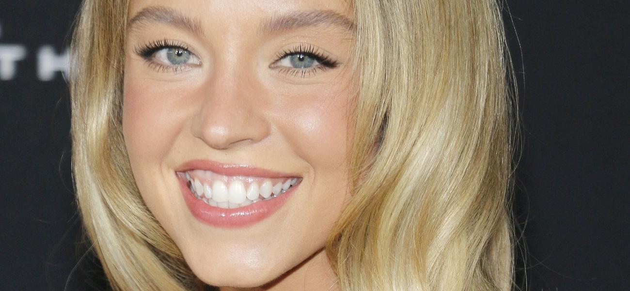 Sydney Sweeney smiling close up