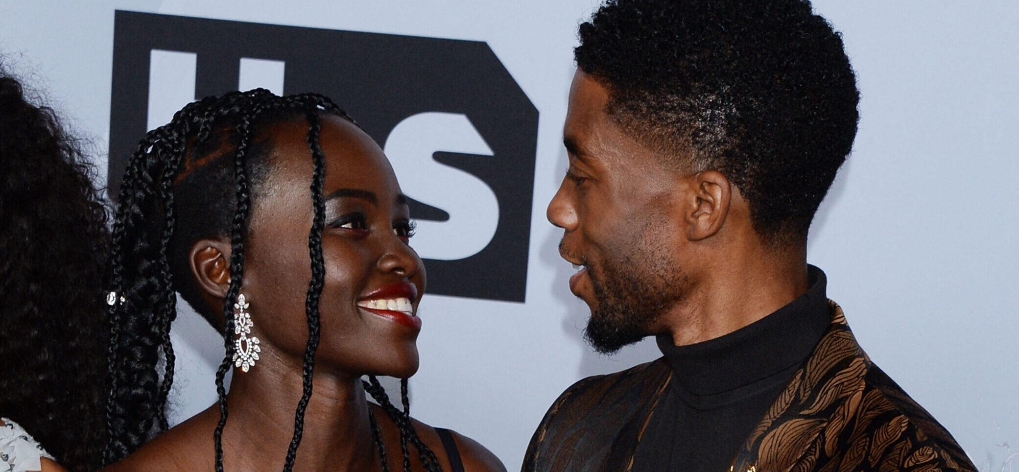 Lupita Nyong’o and Chadwick Boseman smiling