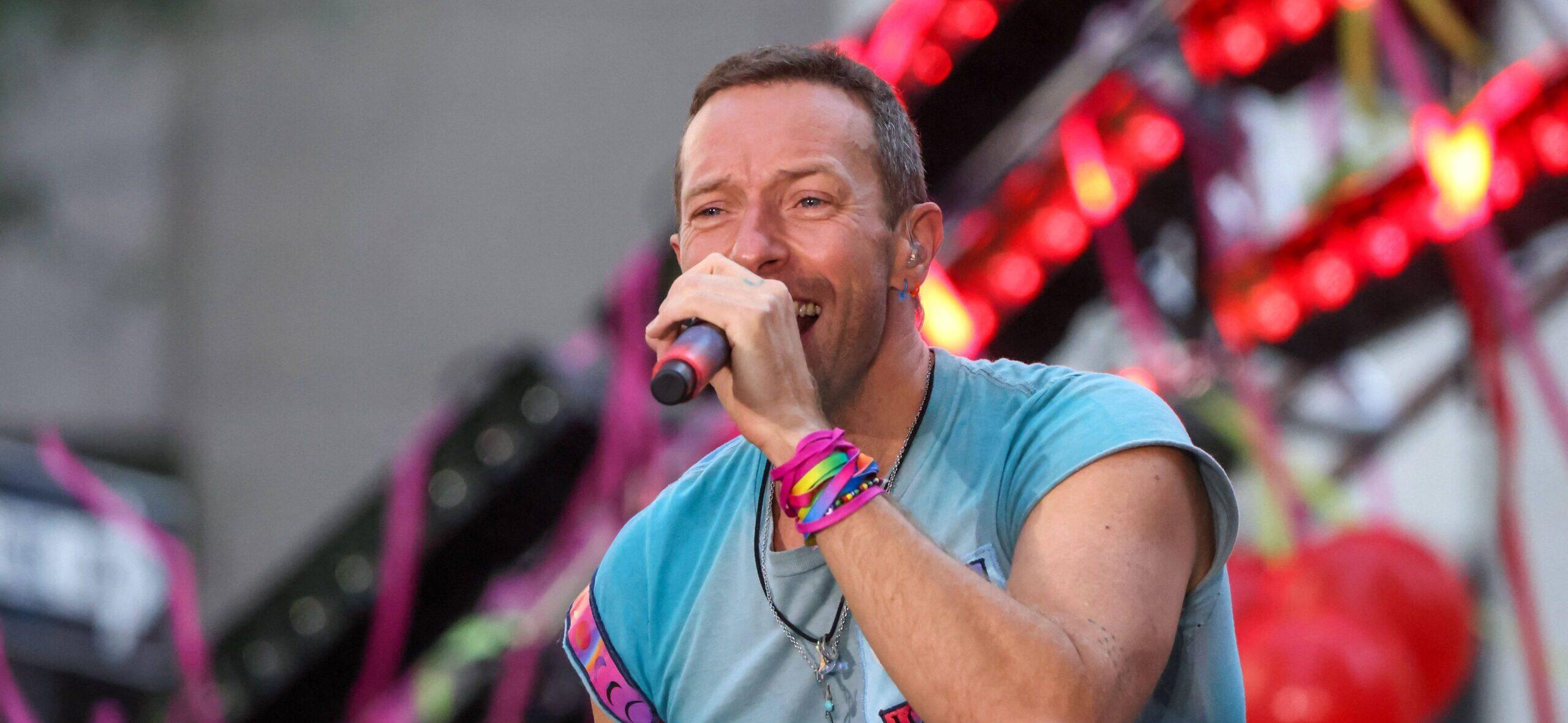 Vocalist Chris Martin along with his band Coldplay during a performance on a television show at Rockefeller Plaza in New York City