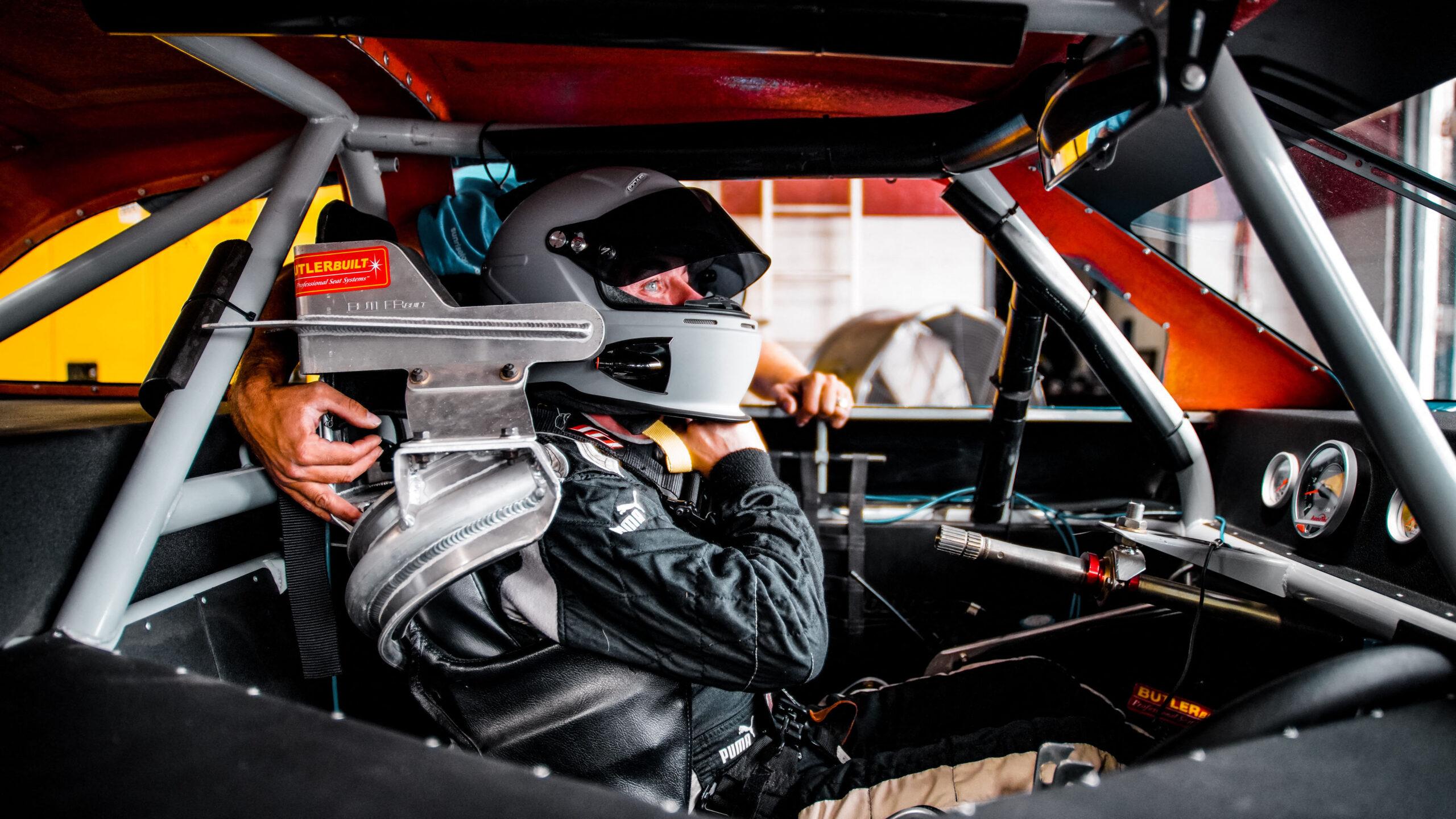 Frankie Muniz sitting in car after he becomes a full-time race car driver