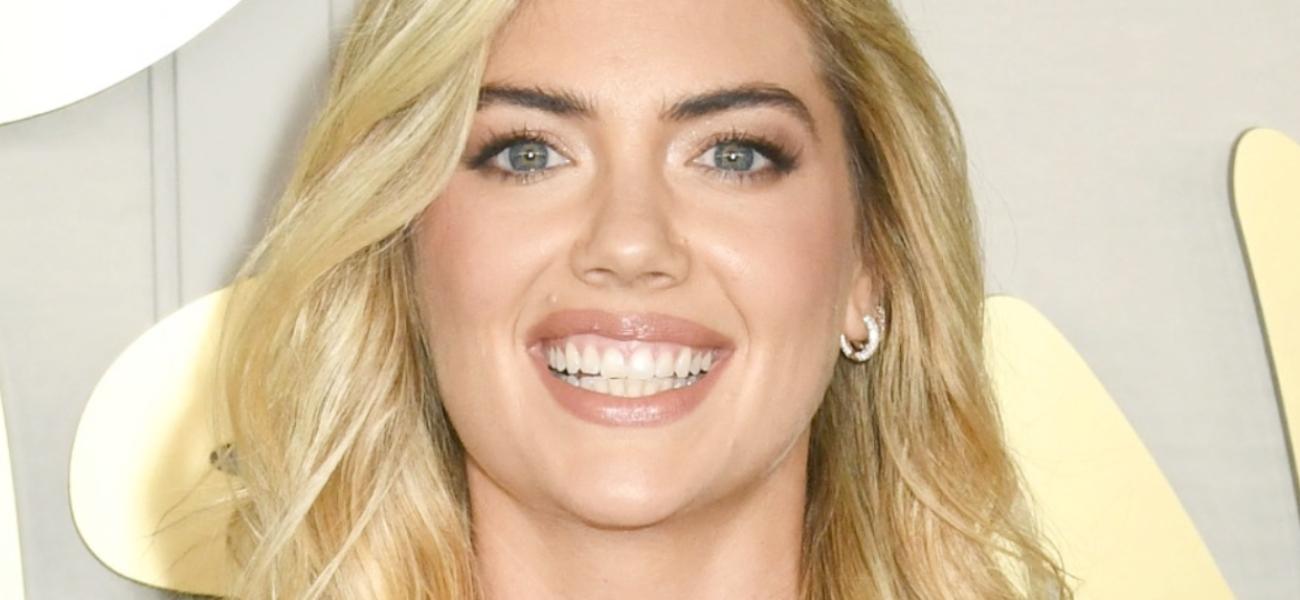 Kate Upton smiles at an event