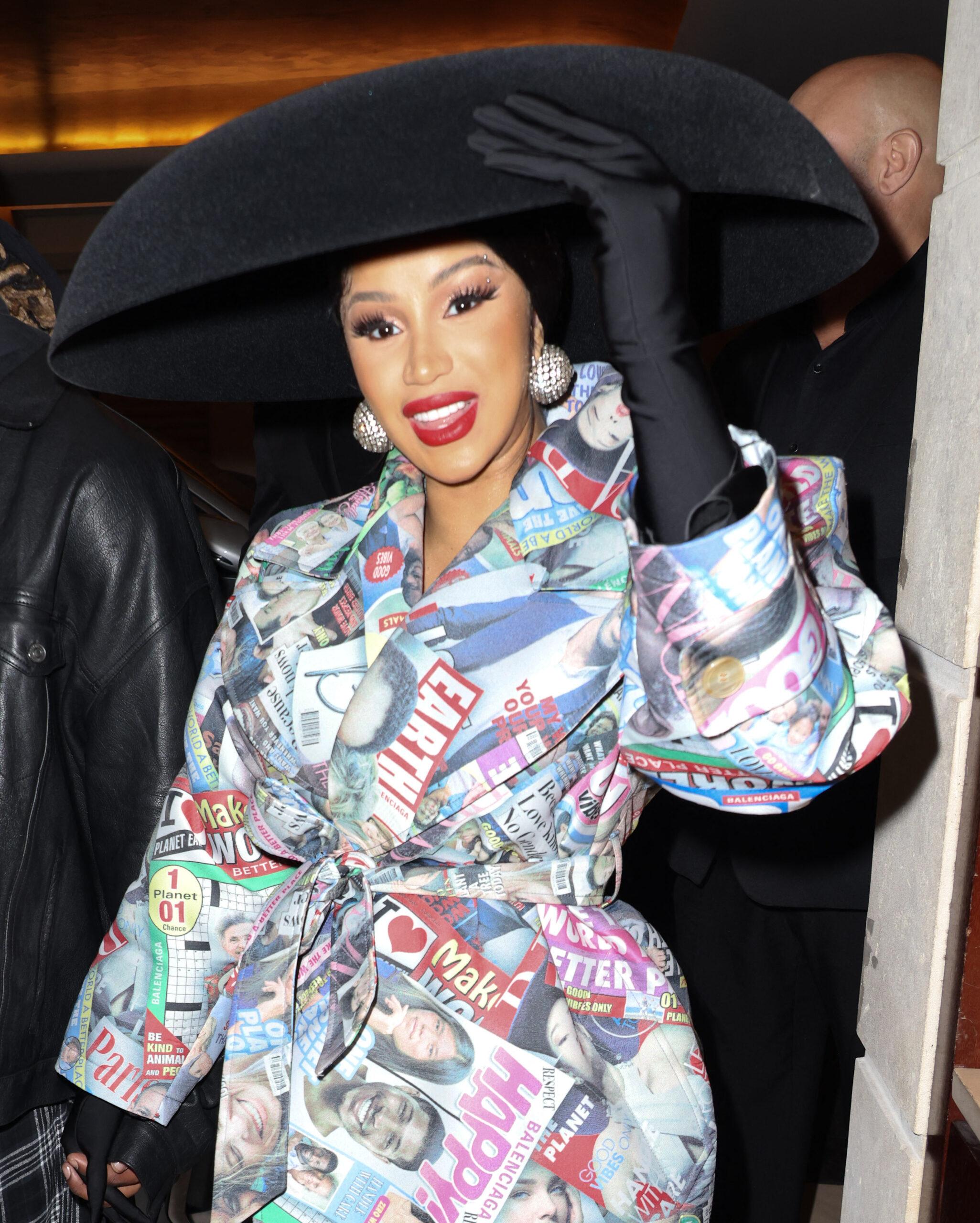 Cardi B waves to fans at Balenciaga show