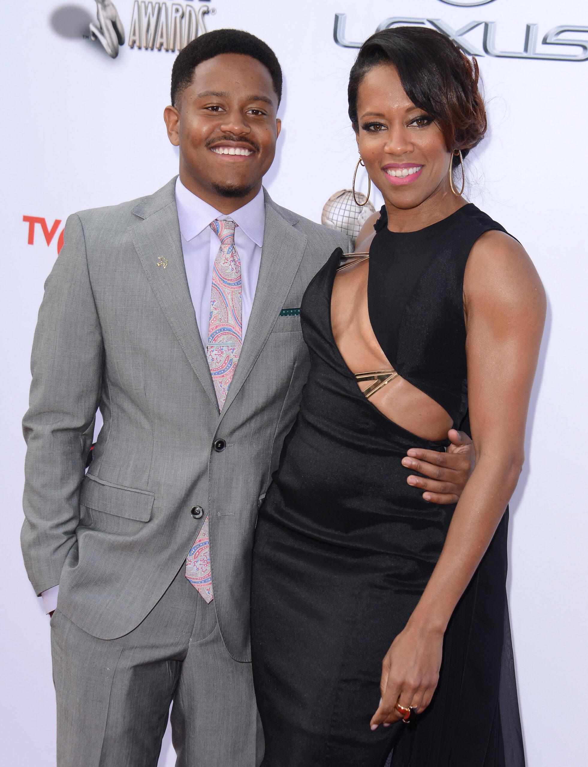 Ian Alexander Jr. and Regina King at CL Chinese Theatre on October 28, 2021 in Hollywood, CA