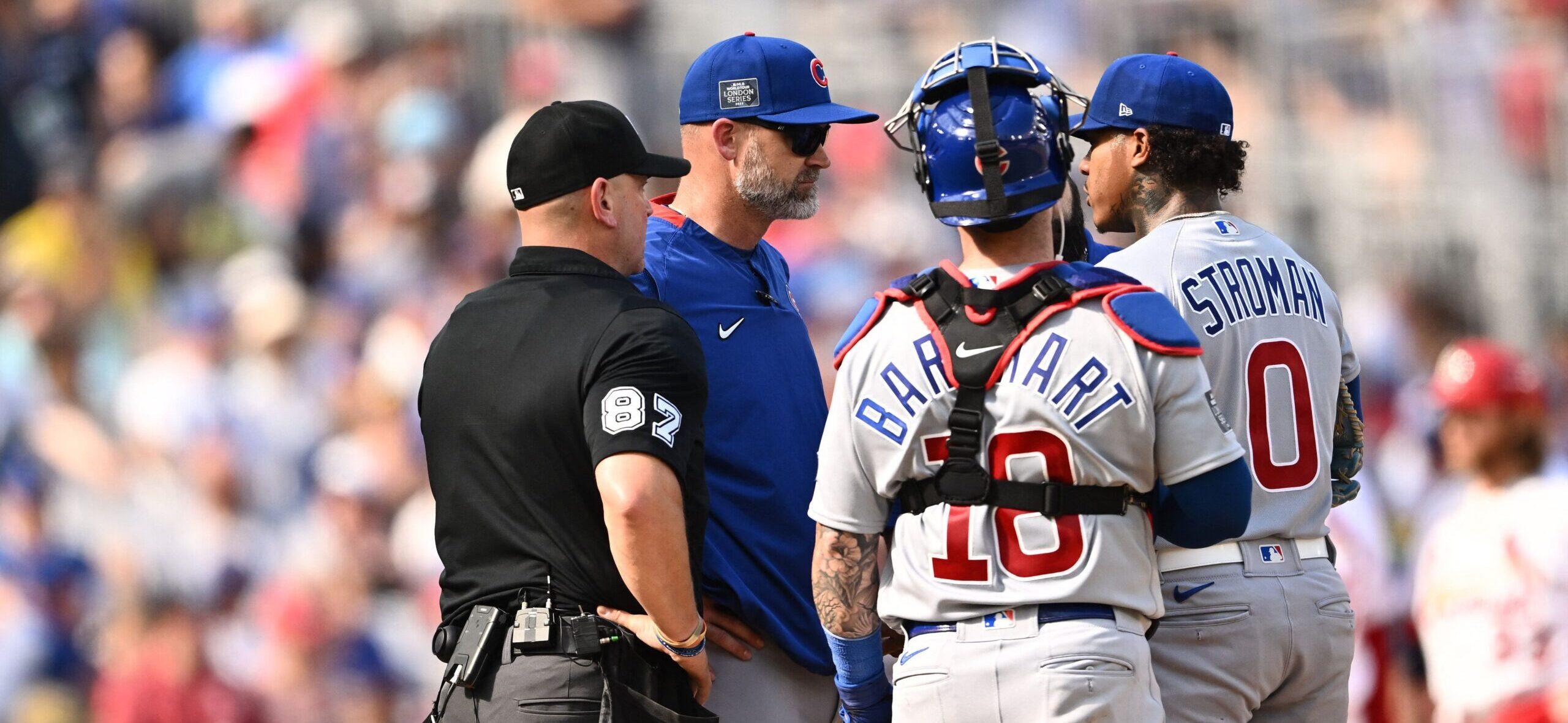 Chicago Cubs coach David Ross speaks to players during the 2023 MLB London Series