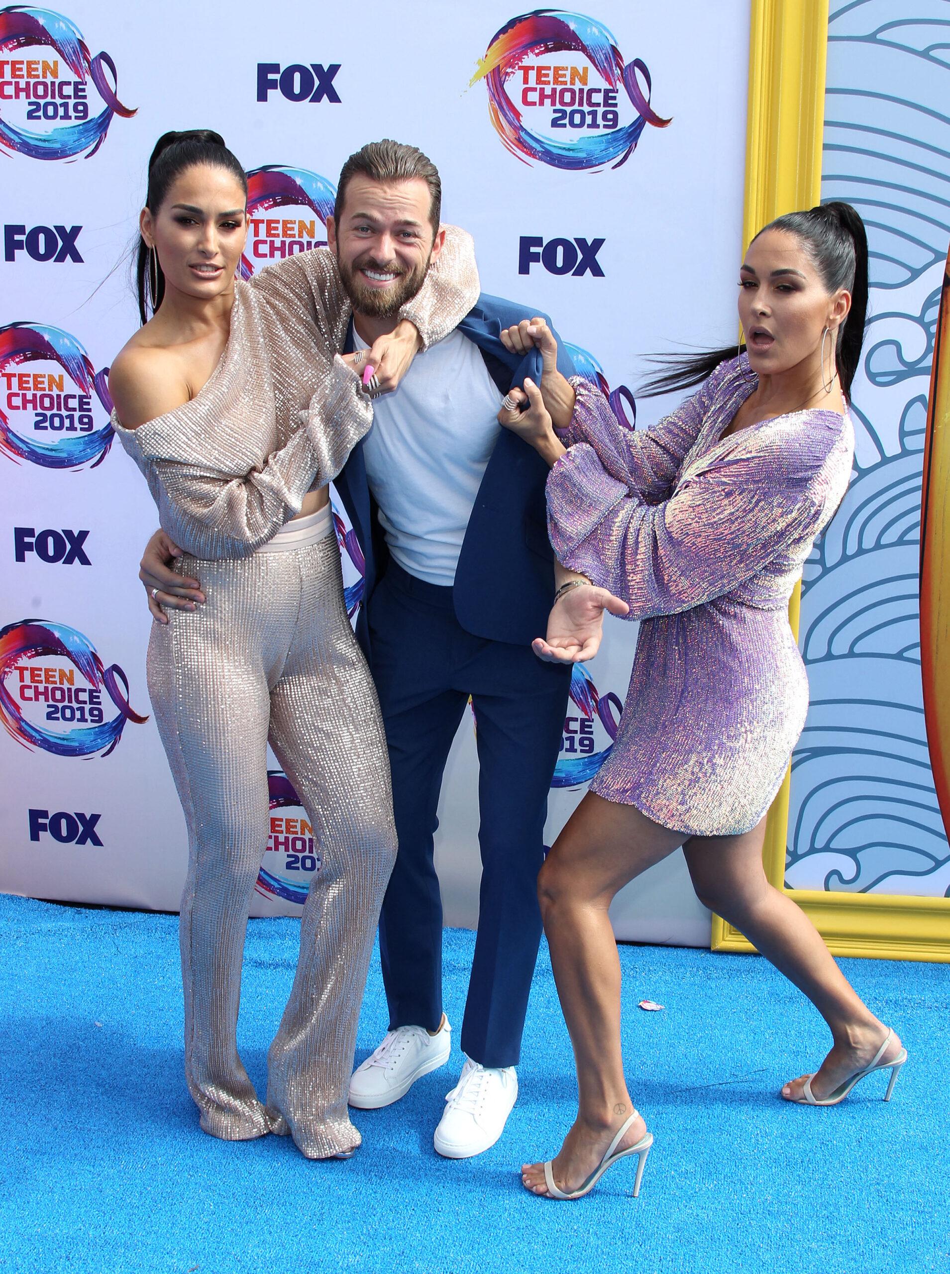 Nikki Bella, Brie Bella, and Artem Chigvintsev at 2019 Teen Choice Awards 