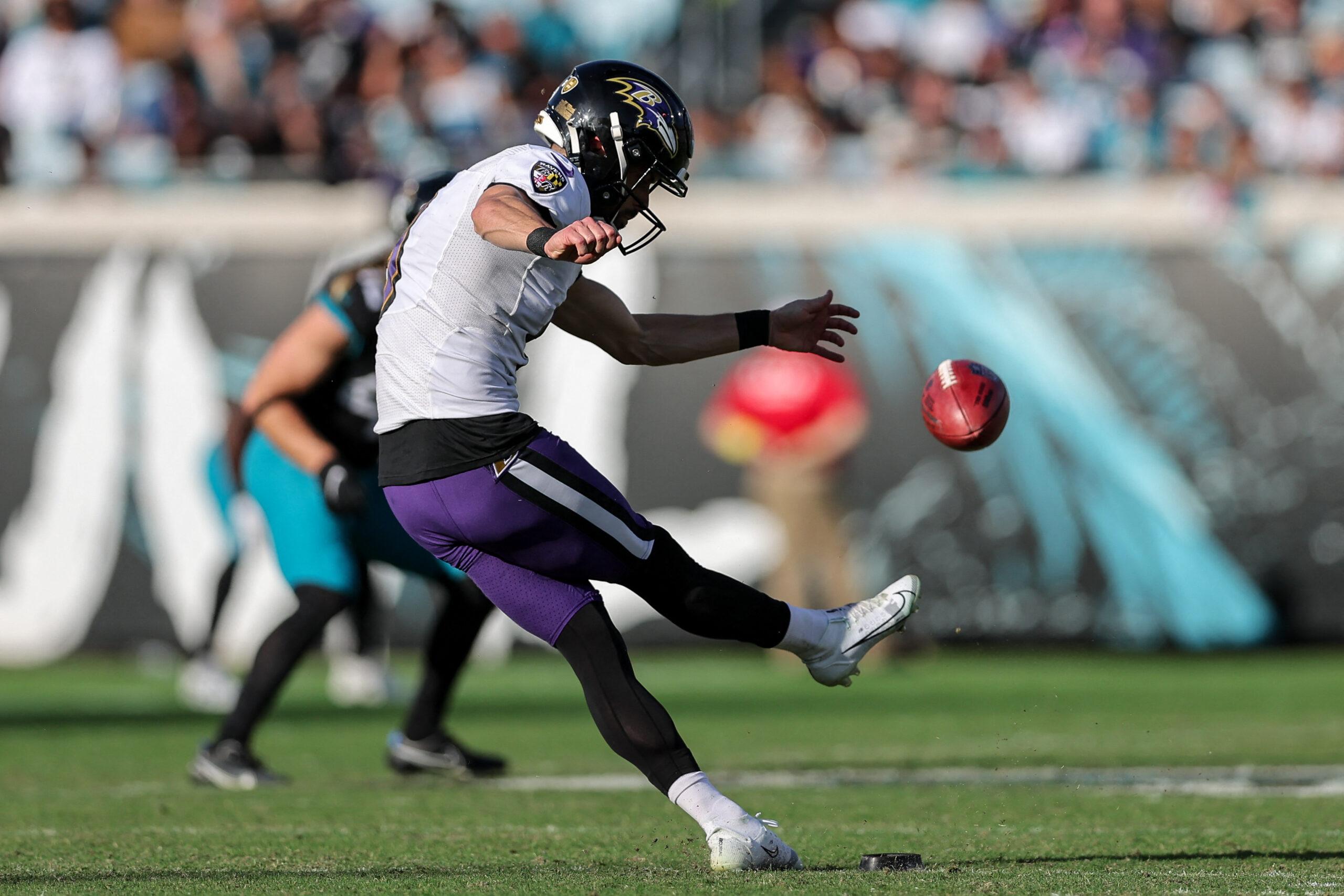 Justin Tucker kicking a football