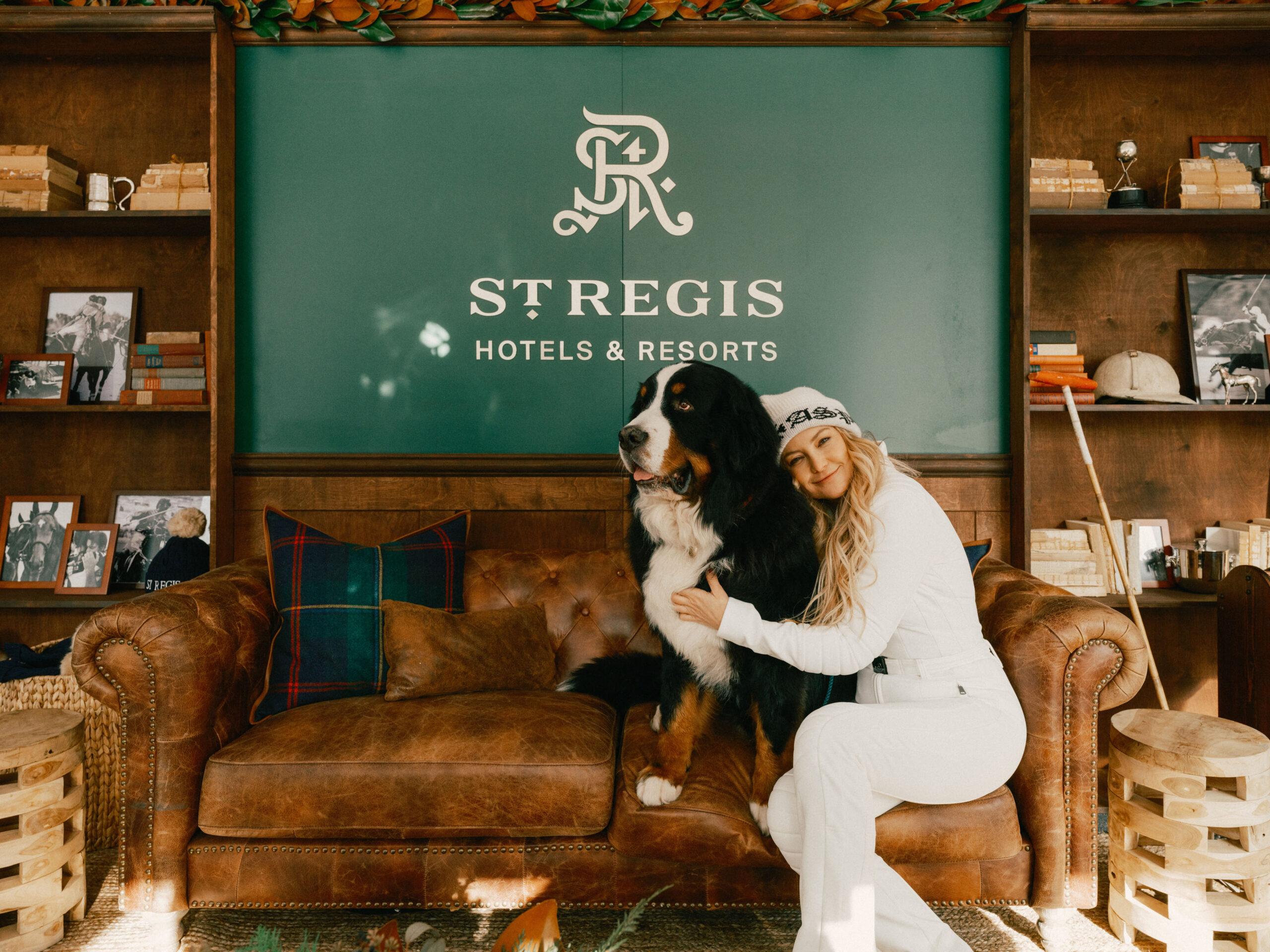 Kate Hudson cuddles a Bernese Mountain Dog at the St. Regis World Snow Polo Championship in Aspen, Colorado. 