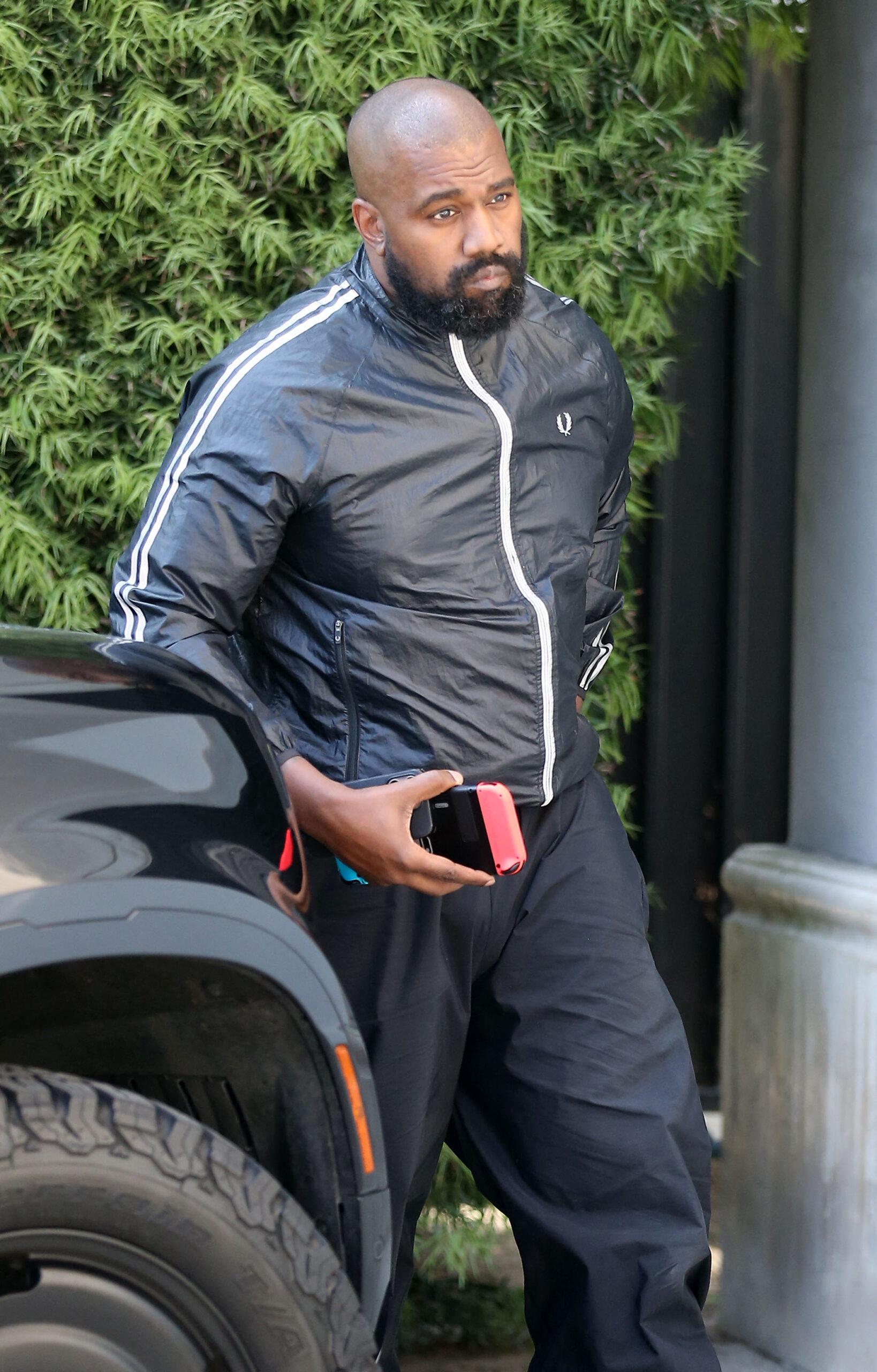 Kanye West is seen arriving solo at the studio