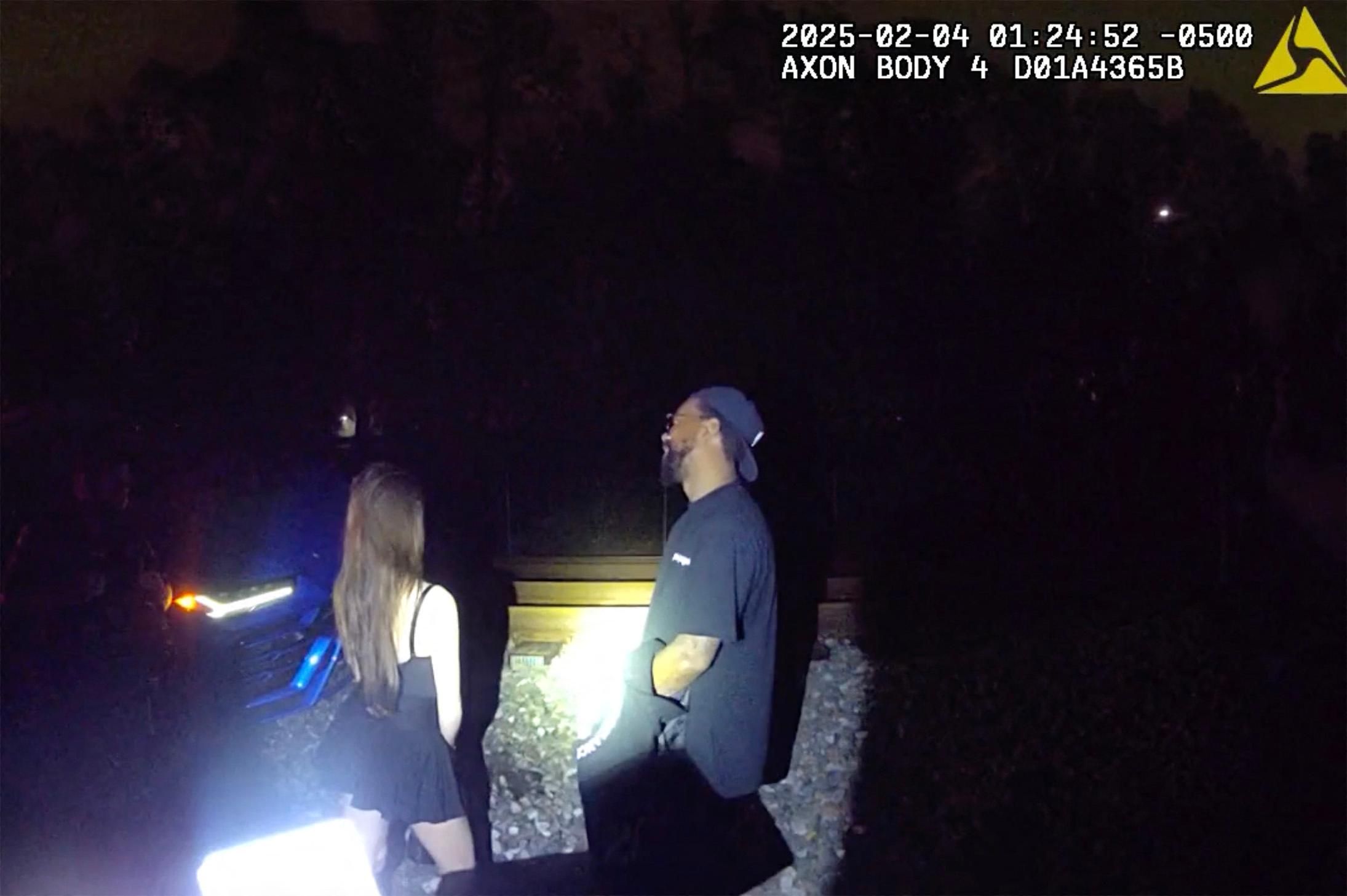 Police bodycam shows Marcus Jordan's DUI arrest after getting Lamborghini stranded on train tracks with his busty brunette passenger.