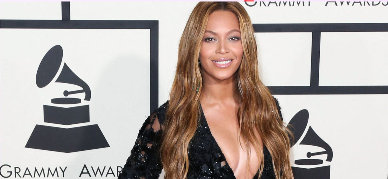 Beyoncé posing in a black dress during a previous Grammys red carpet event.