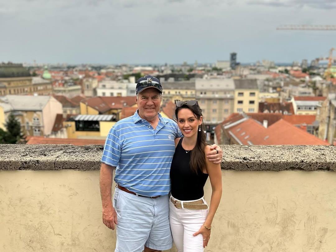 Bill Belichick and Jordon Hudson smiling