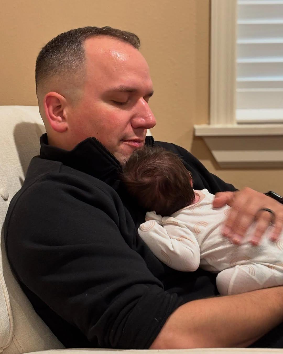 Ken Urker holding baby Aurora