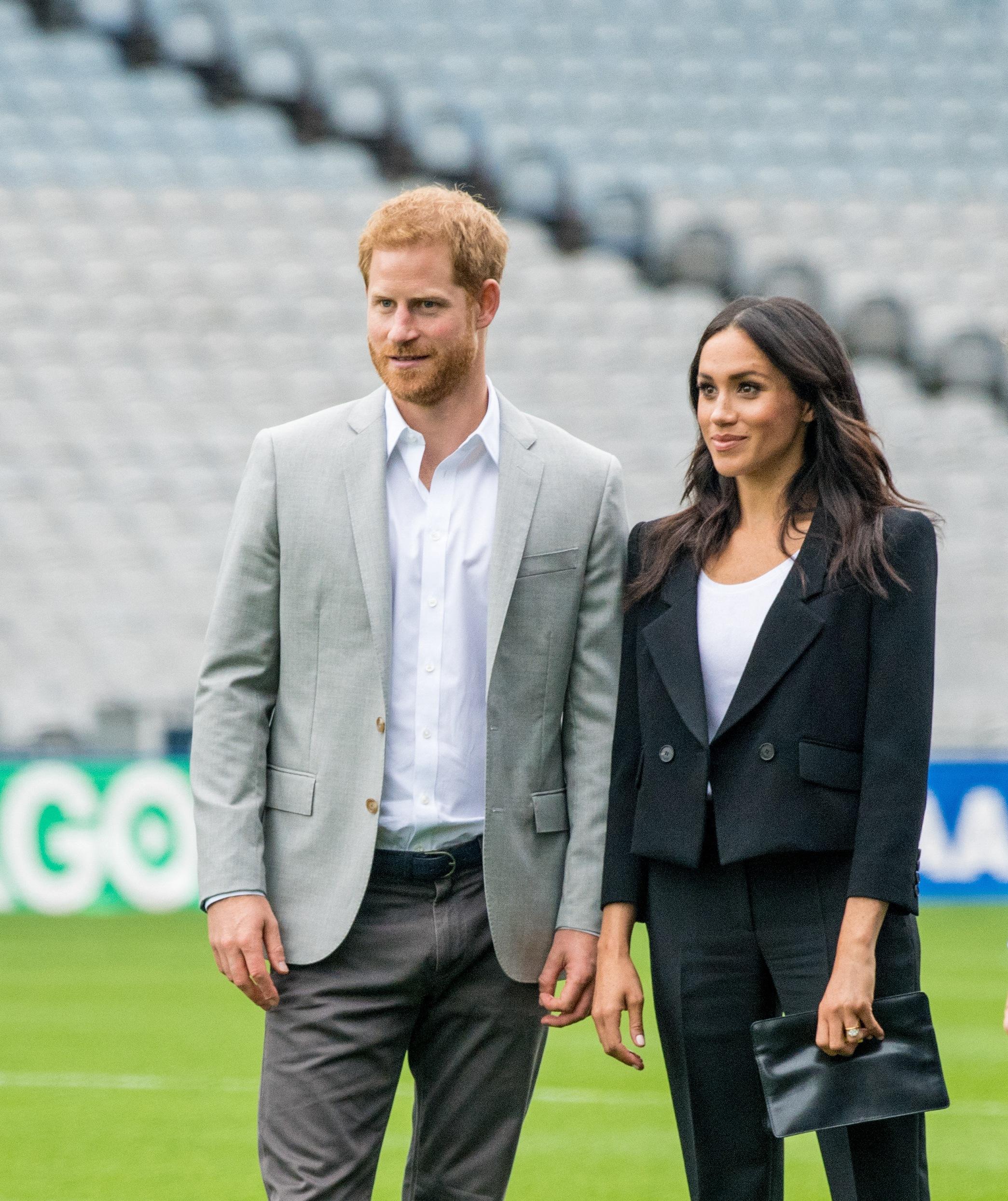 Prince Harry and Meghan Markle standing together