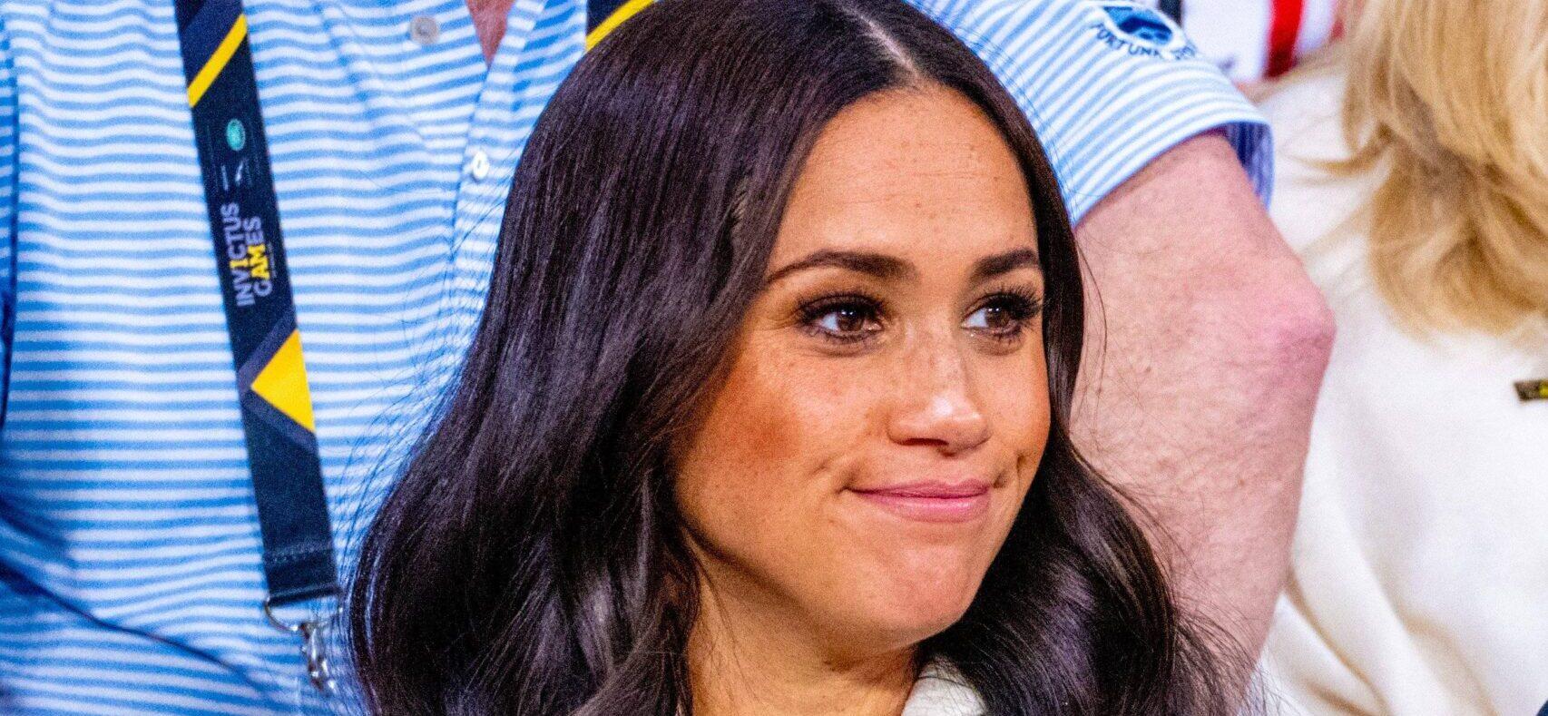 Meghan Markle smirking