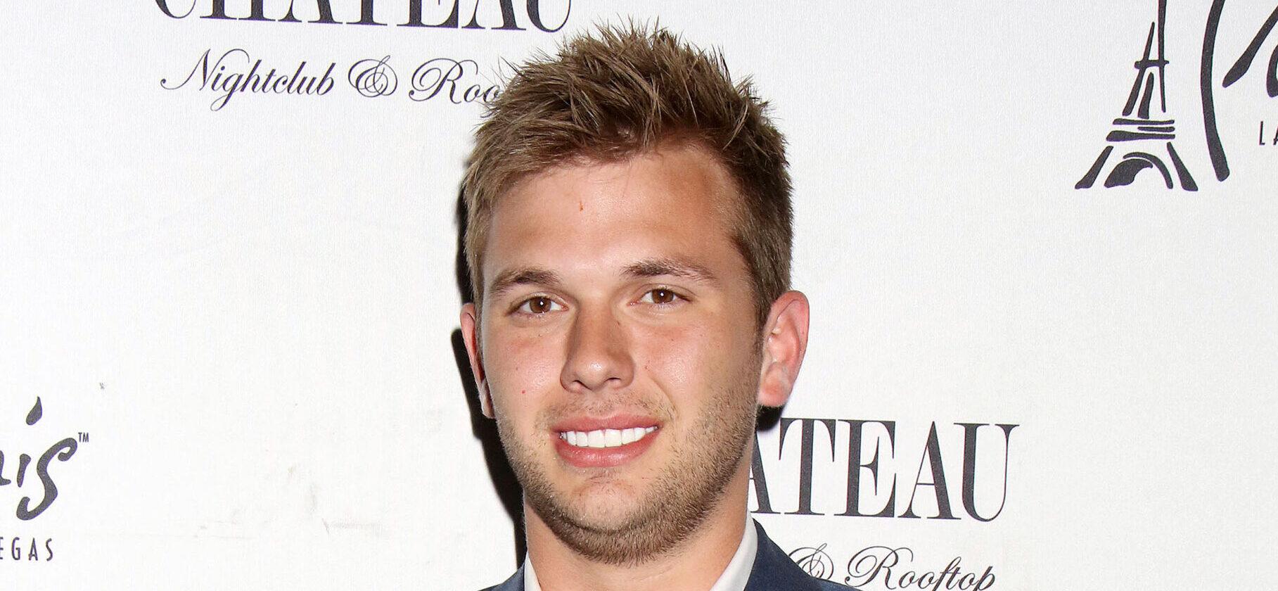 Chase Chrisley posing on the red carpet.