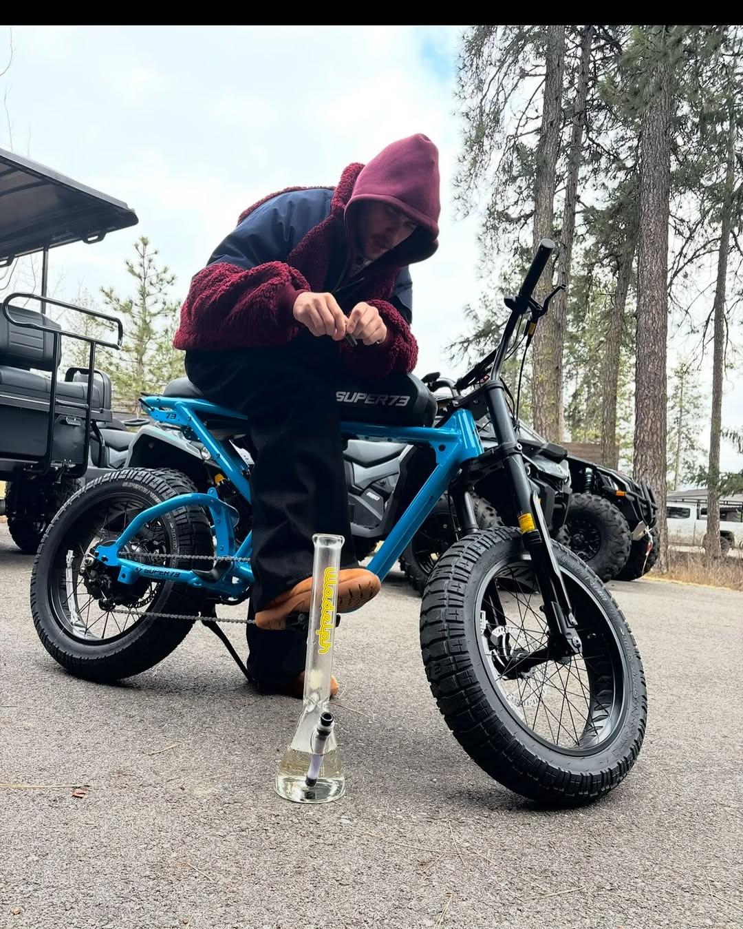 Justin Bieber smokes a bong on a bicycle in new photos