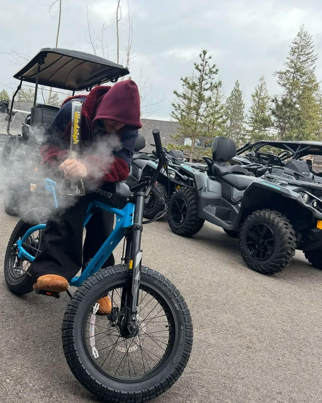 Justin Bieber smokes a bong on a bicycle in new photos