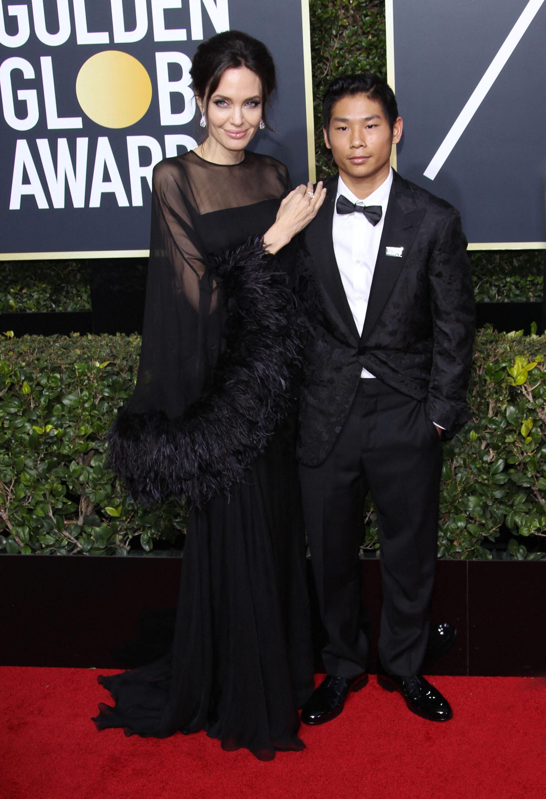 Angelina Jolie and son Pax Jolie Pitt attend the 75th Annual Golden Globes