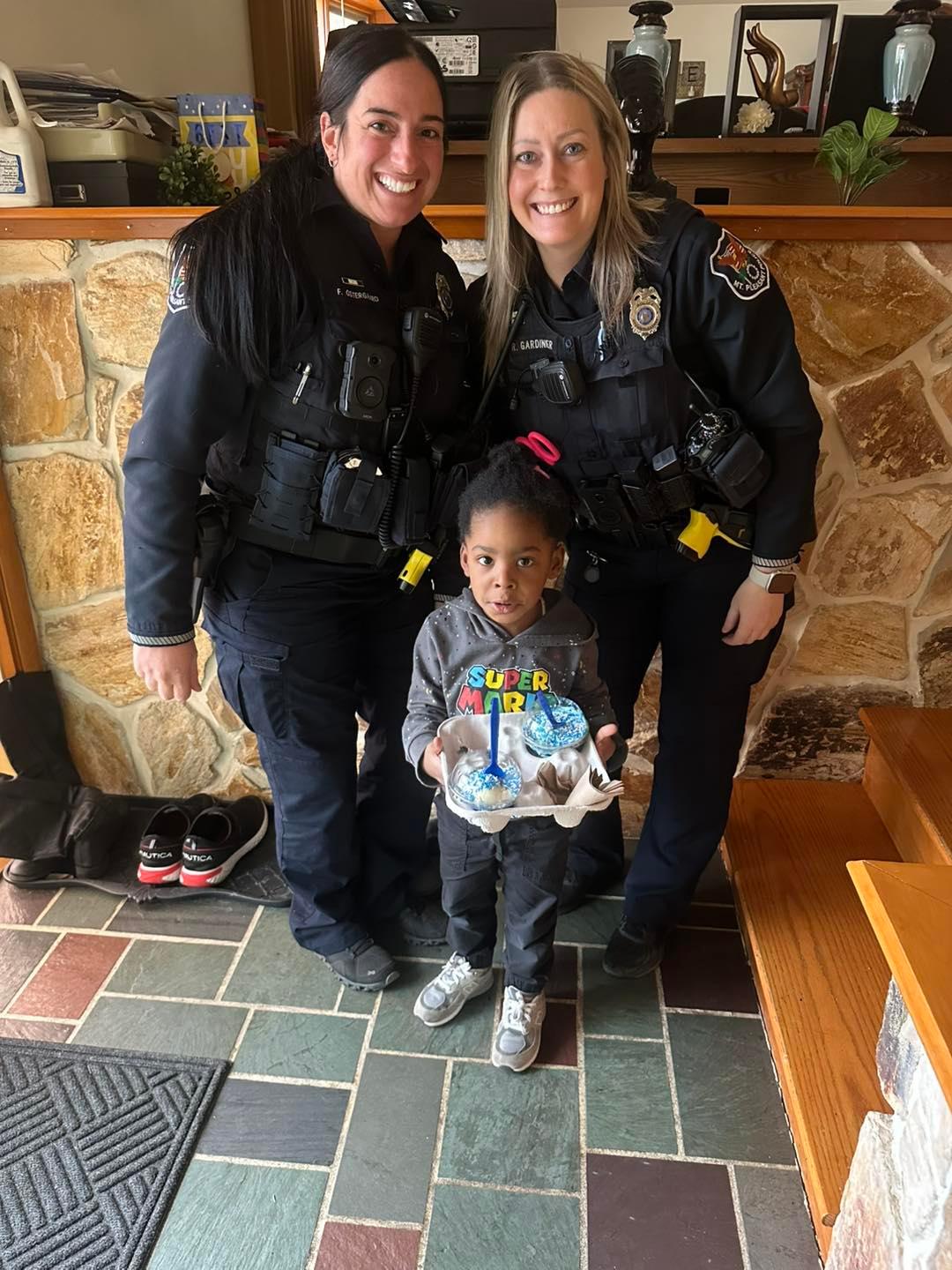 Officer Gardinier and Officer Ostergaard with little 911 caller