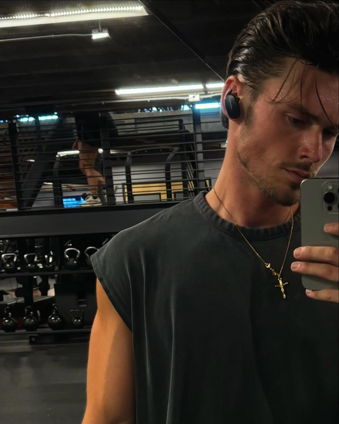 Tyler Breshears takes the mirror a personal photo in the gym