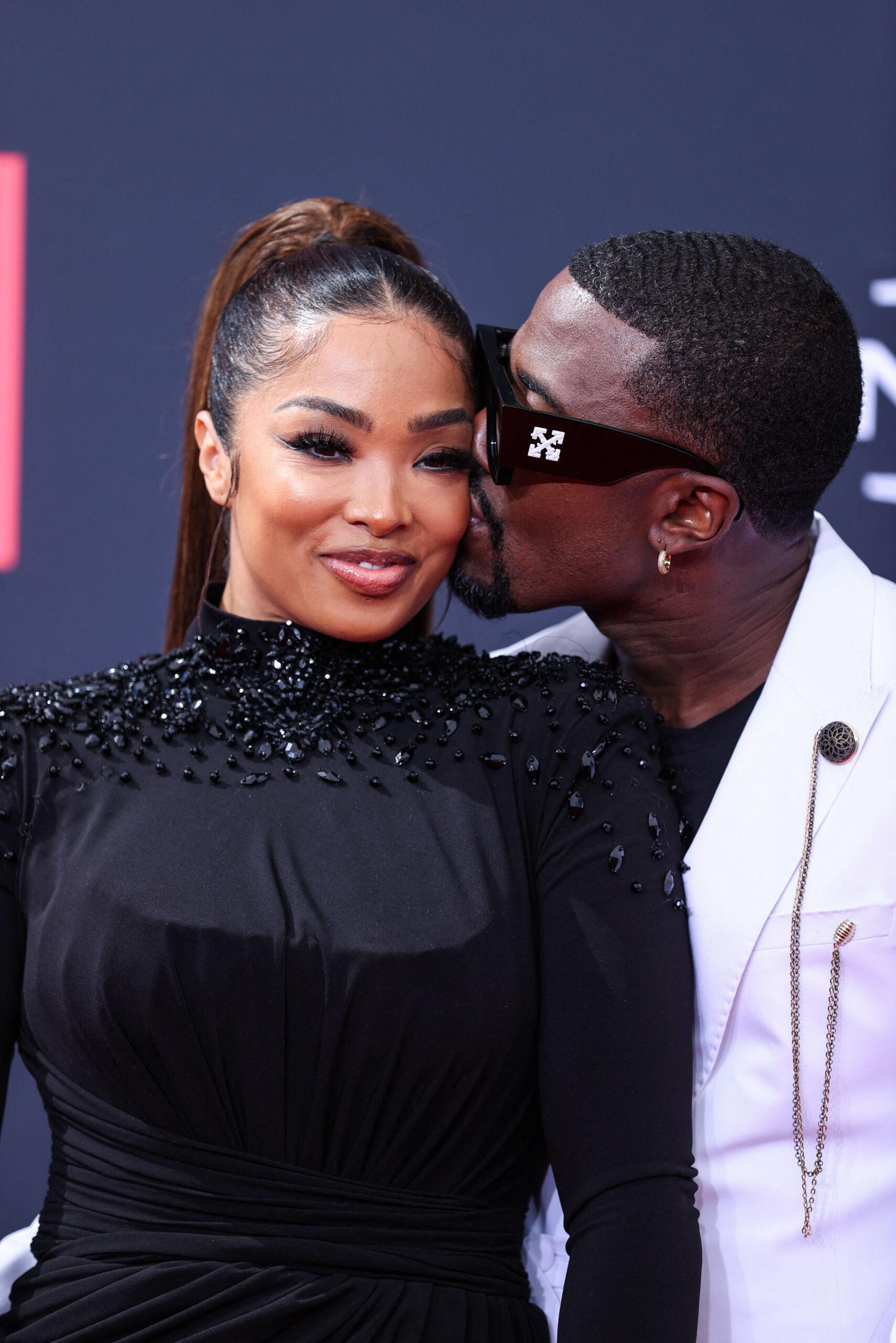 Ray J and Princess Love posing on the red carpet at the BET Awards.