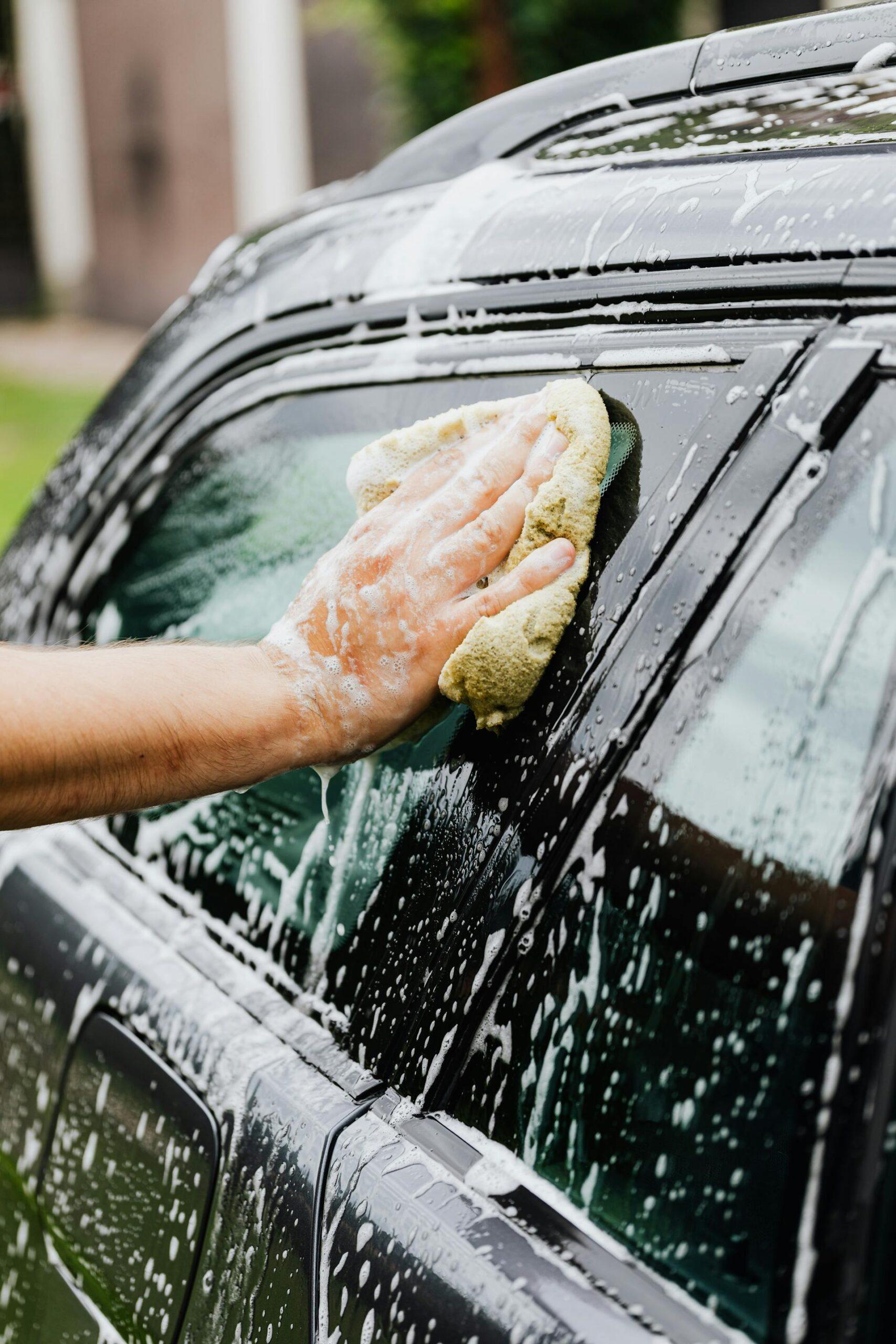 A person washing a car